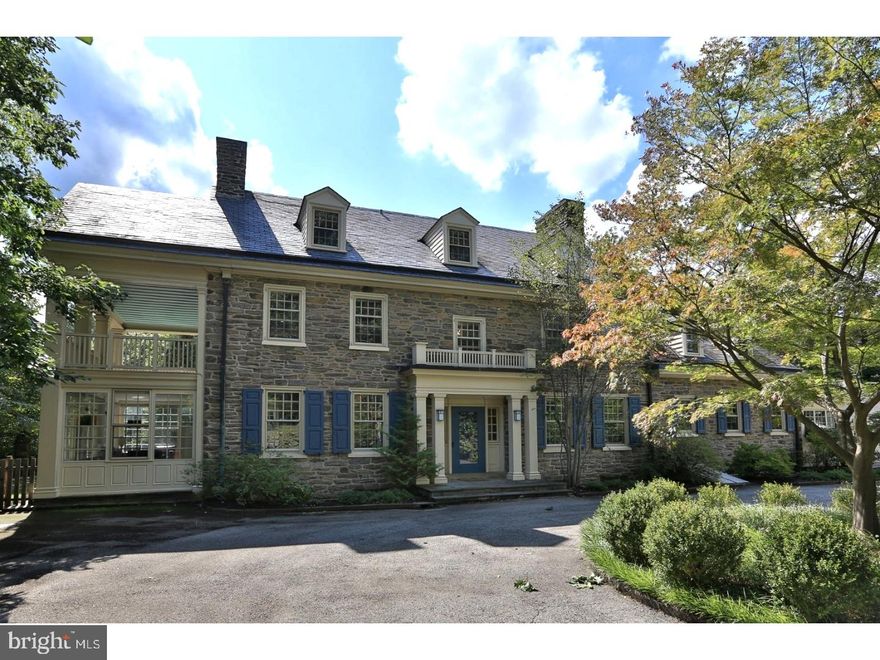 Fall in love with this classic 1925 stone colonial that has been lovingly updated for today's buyer. The charm and character of the original home shine through but the overall feeling is one of crispness and light . Accessed from the stylish center hall is a striking living room with its custom fireplace. An adjacent sunroom/family room has three walls of floor-to-ceiling windows, not to mention some exceedingly attractive garden views. The large dining room is equally spectacular with its architect-designed custom built-ins and  fireplace. A modern, updated kitchen with granite countertops and high-end Dacor appliances leads to a separate laundry room and a small mud room. Upstairs the master bedroom is accompanied by a large four-piece bath with marble floors and jetted tub. A second floor porch beckons invitingly. Two additional bedrooms, a hall bath, and an office/study (possible bedroom) complete this floor, while two large bedrooms and a pair of nicely updated baths round out the top floor.  The house comes with five-zone heating, four-zone cooling, and considerable storage space in the unfinished basement. It's an easy walk to the park, the train (Chestnut Hill West), local schools and a multitude of shops and restaurants, but you may be reluctant to leave this home and its surrounding grounds.