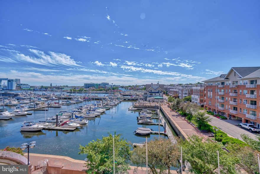 Experience the epitome of luxury living at this exquisite Harborview Condominiums, boasting tasteful accents and modern updates. Revel in the mesmerizing city lights and serene water views that greet you from every corner of this magnificent residence.
Step inside 412 to discover an inviting open floor plan, where private balconies invite you to savor the sights of Baltimore's Inner Harbor Waterfront. The interior is adorned with stunning hardwoods that help fill the home abundantly with natural light.  The kitchen sits just off the dining room with a convenient pass through when hosting. The light colors and white kitchen allow for personalities ranging from minimal to bright and vibrant to take over with the decor.
The spacious living and dining area features a large window, while both the bonus office/den and Primary Suite feature private balconies. The layout allows the property to blend the living spaces with the enjoyment of the amazing waterfront view. The primary bathroom features marble tile throughout with an over-sized jacuzzi tub and shower with spacious vanity.  There is an additional powder room that lies just inside the entrance to the unit.
This full-service building pampers you with an impressive array of amenities and services. The 24/7 front desk offers concierge and doorman services, while you can unwind in the billiard room, social lounge, or one of the conference rooms. Enjoy outdoor gatherings on the patio grill area or maintain your fitness regimen in the state-of-the-art fitness center with steam and sauna facilities. For your out-of-town guests, there are comfortable guest suites available. The meticulously landscaped grounds offer scenic waterside paths for walking to the Harbor and beyond. Also along these paths you will find accent fountains with sculptures adorned with trimmed bushes and flowers. Truly is a serene community.
This unbeatable location places you in close proximity to an array of dining establishments including Dipasquale's and Little Havana, shops, both Camden Yards & Ravens Stadium, the MARC train, and less than 20 minutes to BWI. Don't miss your chance to witness this exceptional property – it's a must-see!
