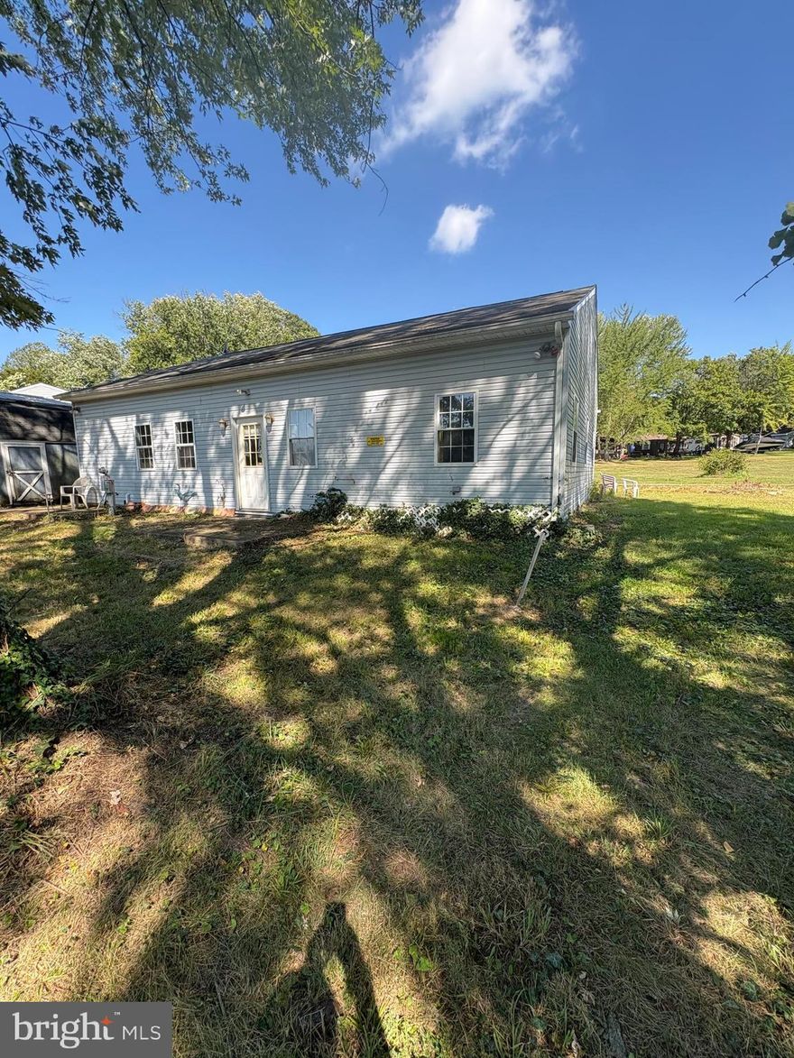 Escape to your very own retreat in the private Indian Acres community!  THIS IS A FRAME BUILT, BEAUTIFUL HOME WITH TALL CEILINGS AND LOTS OF ROOM, IT IS NOT A MOBILE HOME.   This rare 1,200 sq. ft. home offers 4 bedrooms, a full bath, kitchen, dining room, and living room, creating the perfect getaway for family and friends.  Set on three lots, this property provides not only space and privacy but also flexibility—store your boats or camper on the vacant lot and enjoy stress-free weekends without the need for outside storage.  
Life at Indian Acres is all about recreation and relaxation:
*Bohemia River access with a large boat ramp, perfect for boating, fishing, and water adventures. 
 
*Community pool and bath houses for warm summer days.  Fishing pond and fields for football, baseball, and outdoor fun. 
*Community building for gatherings and events.  On-site convenience store for all your last-minute needs. 
This private community, not an HOA.  Owners can live here up to 180 consecutive days per year, making it the ultimate seasonal vacation home or weekend escape.  YOU DO OWN THE LAND and you pay a yearly property tax on the ground.  If you’re looking for a place where every weekend feels like a getaway—with boating, swimming, fishing, and outdoor fun right at your doorstep—this is it!