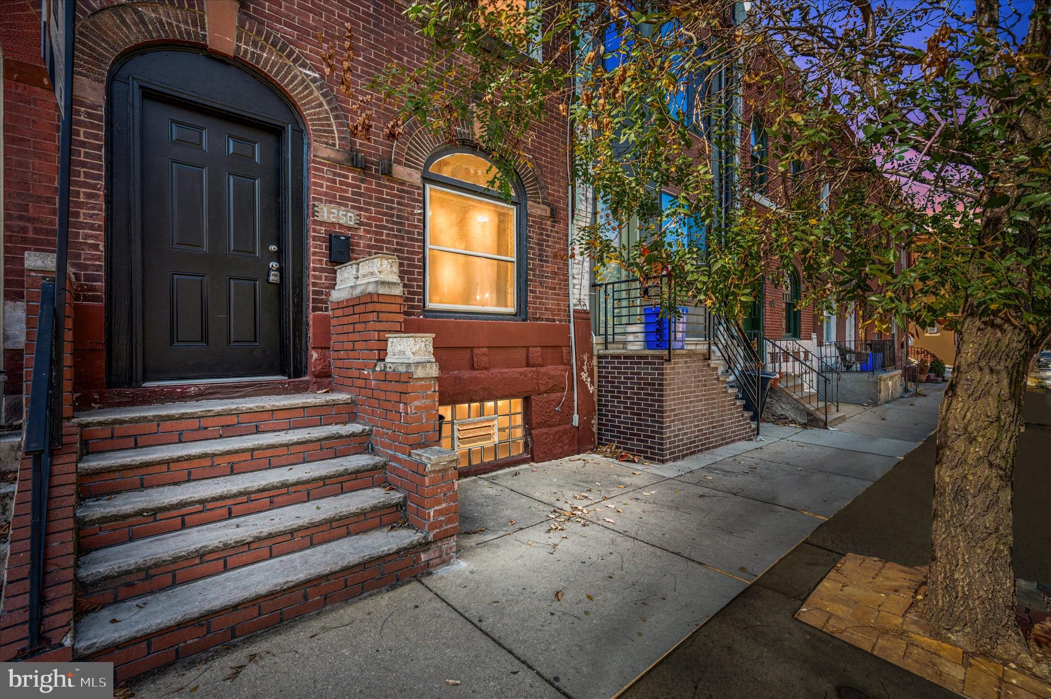 Welcome to 1250 N 29th Street, a charming updated row home nestled on a prime Brewerytown block. Showcasing a timeless brick facade, a spacious 16-foot width, and engineered hardwood floors. A contemporary kitchen with sleek granite countertops, breakfast bar, and a subway tile backsplash. Main floor washer/dryer with designated laundry room just past the kitchen and a large, sunny back yard for relaxing and entertaining. The second floor bedrooms pay homage to the city's rich history with custom built-ins and trim work while both bathrooms have been thoughtfully remodeled, providing a fresh and contemporary feel. There is a full unfinished basement for additional storage. Located just steps away from Girard Avenue, you'll enjoy easy access to neighborhood hotspots including Otto's Taproom, 2637Brew, Spot Gourmet Burgers, and Brewerytown Bakery. Walkable to ALDI, Fairmount Park and Kelly Drive. A must see!