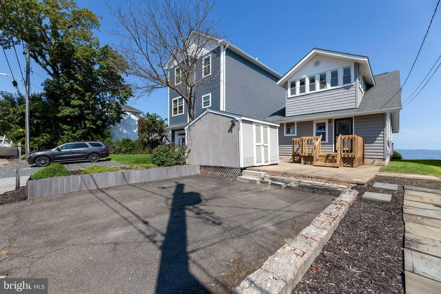 Have you always wanted to live on the Bay?  This cozy Bay front, 4 bedroom Cape Cod may be just what you have been looking for.  The rich wood paneling throughout the home just glows when the sun comes through the many windows.  On chilly nights enjoy a nice warm, crackling fire in the stone fireplace.  On warmer days enjoy sitting on one of the two decks and watching the boats and the sea birds.  You can even  see the 4th of July fireworks over the Bay.  Enjoy your morning coffee as you watch the sunrise from your private Owner's deck, located right off your bedroom.  This home is just steps away from the North Beach Boardwalk.  Easy access allows  for a twilight stroll on the boards or a visit to the Friday Night Farmers Market next Summer.    Chesapeake Beach/North Beach is a very walk-able area.  It has lots of little shops and there is always something happening.  Easy commute to Joint Base Andrews, DC and the Beltway.   Submit all offers by midnight 9/13/20.