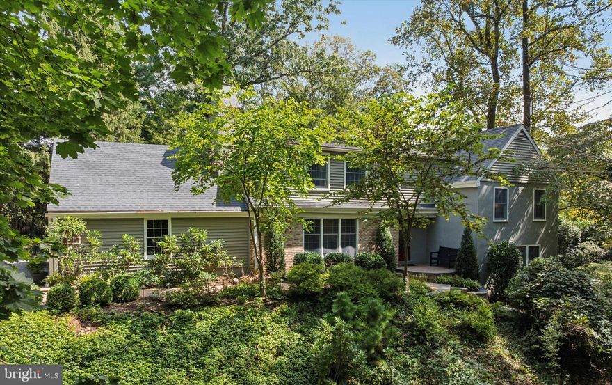 Welcome to 103 Deepdale Road.  Located in one of the Main Line’s most desirable neighborhoods, this brick and siding split level offers 3,138 square feet of luxurious living space, five bedrooms, three full and one-half bathrooms, a two-car side entry garage, screened in covered porch, and a 1.7-acre lot, seamlessly blending functionality and privacy.  The main level includes a welcoming entrance foyer with coat closet, living room with built-in shelves and wood burning fireplace, and a dining room with crown molding and a slider to the covered porch.  The highlight is the gourmet kitchen featuring white cabinetry, a center island with seating, stainless steel appliances, quartz countertops, and overhang seating for four.  The first upper level includes the primary bedroom suite with a full bathroom and two closets, a large secondary bedroom with double door closet, and a recently renovated full hall bathroom with subway tile surround, tile floor, and shiplap accent walls. The next level up has three spacious bedrooms and another recently renovated full hall bathroom with white subway tile shower surround and glass shower enclosure.  The walkout lower level has a family room with tile floor, built-in shelves, and a double French door to the rear paver patio, a half bathroom, and a partially finished area with laundry and storage.  Other highlights include hardwood floors throughout most of the main and upper levels, newer roof (2017), newer kitchen appliances and countertops, screened-in covered porch with ipe hardwood floors, vaulted ceiling, and exposed beams, Anderson windows, and newer paver walkway with steps leading to front door and rear yard.  The home overlooks a 1.7-acre wooded lot with mature oak and maple trees, leading down to a small creek. It’s a perfect spot for kids to play outdoors, build forts, roast smores, and explore nature.  All while being conveniently located close to all major commuter routes, shopping, dining, downtown Wayne, King of Prussia and is part of the top rated Tredyffrin-Easttown School District. Deepdale is a close-knit community known for its strong neighborhood association and family friendly events.  Enjoy walking to the Strafford Train Station, Strafford Library, and Strafford Park.