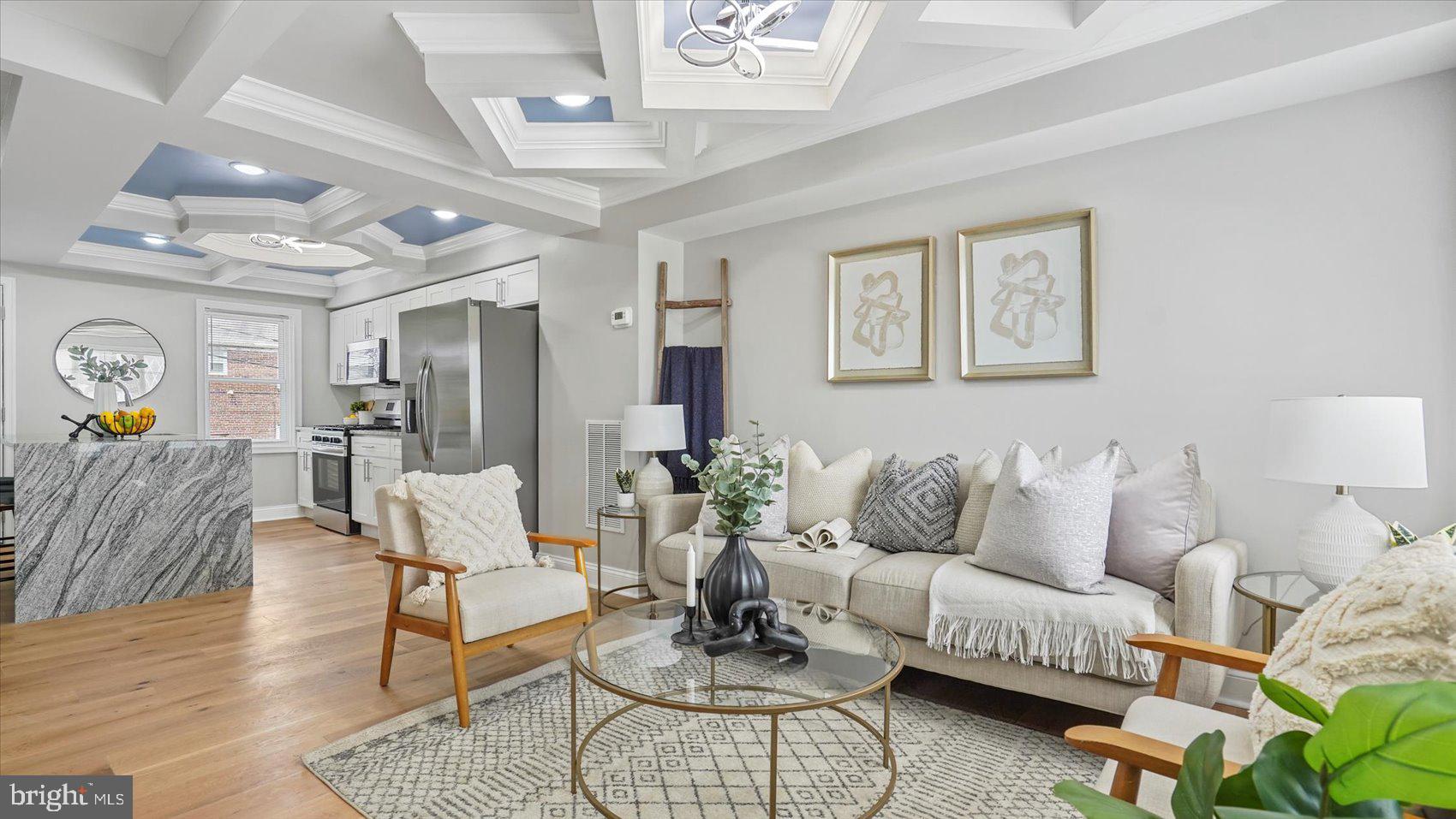 A stunning transformation has taken place behind the doors of this 4BR/2BA brick Townhome located in the Uplands. Make your way to the front door and step inside a glamorous main floor featuring custom coffered ceilings, recessed lighting, luxury flooring, tons of natural light, and an open floor plan. The main floor offers a large living room open to the stunning kitchen, both with two tone ceilings. The kitchen features plenty of cabinets to the ceiling, stainless steel appliances including a natural gas range, beautiful granite countertops with a subway tiled backsplash, and a stainless sink in an island with a waterfall edge, and breakfast seating for three or more. The newly carpeted second floor offers two secondary bedrooms, a spacious primary bedroom, and a brand new full bath. The lower level offers additional living space including the fourth bedroom, a full bath with a beautifully tiled walk-in shower, a spacious family room, laundry, storage, and a walk-out to the fenced yard. From the kitchen step outside to a large wood deck that overlooks a yard filled with green space and tons of possibilities. This home is move-in ready, perfect for any new homeowner, and is located in close proximity to shopping, restaurants, and commuter routes.***SELLER PREFERS TO USE HIS TITLE COMPANY***
