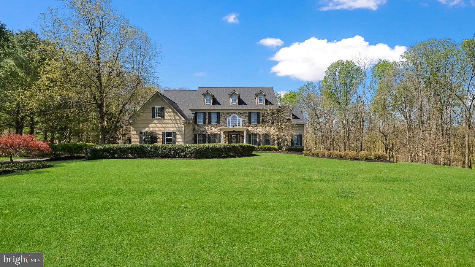 This stately new listing is nestled within the heartland of Bucks County and backs to approximately 25 tranquil acres of protected & private wooded open space. The community has a professionally landscaped entrance with an island & enclosed bus stop that blends into the existing beauty. This classic estate sits on a 1.3 acre lot at the top of the cul-de-sac with outstanding long distance views. This home is abounding in architectural detail and traditional old school craftsmanship, featuring a lovely stone front exterior with portico. Highlights of this tranquil estate feature 5,094 sq. ft. above grade & 2,704 finished sq. ft. in the daylight walkout lower level. This home features 4 bedrooms, 6 full baths, 1 half baths, 1 fireplace, and 3 car garage. It also has a beautiful fully refinished heated in-ground pool with a swim-up bar & outdoor living space with full kitchen. The elegant two-story entrance foyer & upstairs hall are accented with impressive two-piece crown molding & gleaming hardwood floors. Custom crown moldings & detailed wood trim in the dining rm, living rm & office. The newly remodeled gourmet Kitchen is distinctive because of its size, layout, design and an abundance of the very best appliances and amenities; comprising of a new tile backsplash, marble counters, island pendant lights, new 48” gas range, newer microwave, pantry with built-ins & Belle ladder, breakfast room seating AND is open to both the morning room & the 2 story family room with a designer wood burning stone fireplace with glass doors, custom mantel & trim. The half bath has been updated with a new vanity & toilet. The second floor offers an impressive double doored Master Suite that includes an enormous sitting room, his & her luxurious bath with double sided shower, walk-in closet with organizers, stylish barn door and breathtaking views of the grounds. 3 additional bedrooms include massive closet spaces with organizers. Two bedrooms are en-suite. The Lower Level is truly impressive with an entrance from the outdoor patio & pool, boasting a full bath for the swimmers to change if needed, bedroom area, gym, designated play room with built-ins, billiard room and lounging/media area. There is also a great deal of basement storage with wood shelving to keep holidays organized!! Spacious 3 car garage with epoxied floor, 3 new doors and interior access to a beautifully updated mudroom/laundry room with a built in sink, matching cabinet, backsplash, bench seating & hook organizers. The expansive outdoor living area continues to amaze and impress offering many entertaining and relaxation opportunities: an expansive exterior living room at the upper patio off the sunroom with turf, walk down & lounge by the heated pool with swim-up bar or cook under the pergola in the professional outdoor kitchen with 4 ceiling fans with wall controls to keep the warm summer night cool. A true escape! Outdoor storage shed for pool equipment and furniture cushions, etc.. Upgrades/Improvements: New roof 2022, pool totally refinished in 2021, new wood fence & gates, new carpet in all bedrooms & closets, all LED lighting. All new chandeliers in kitchen, dining room, master closet, basement steps & child closets. Full house generator. Refinished hardwood floors & new hardwood floors in family room, living room, upstairs hallway & basement steps. All new landscaping plants & red tipple throughout all the back flower beds. Location: Northampton Township offers quick and easy access to the major commercial centers in Bucks County, Philadelphia and New Jersey via I-95, Route 1, the PA Turnpike, as well as commuter rails from nearby stations. Cedarbrook Farm is convenient to local commerce, culture, dining and recreation. The quaint town of Newtown, is minutes from the house. The highly respected & award winning Council Rock Schools make this neighborhood a very sought after community to live. Council Rock HS North, Newtown Middle & Wrightstown Elementary.
