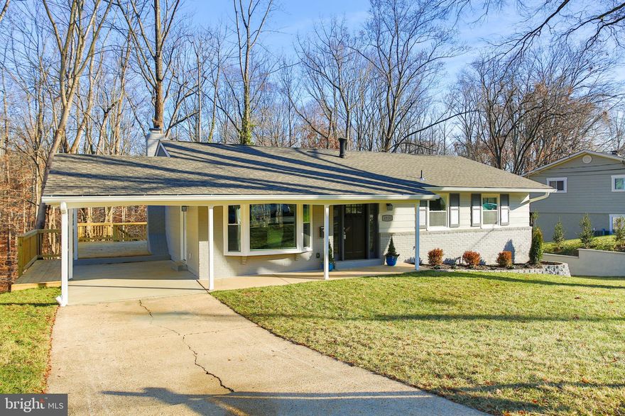 This is a MUST SEE! Gorgeous and upgraded from top to bottom. New architectural roof, new windows, new exterior paint and welcoming landscaping. Brand new deck extra large to enjoy the privacy and tree scenery.  Deck and back yard backs up to park and very mature trees.  Designer kitchen with white cabinets, granite counter tops, SS appliances. Tons of natural light and recessed lighting flood the first level of this home. Gleaming hardwood floors are spread through the entire floor. Fully upgraded bathrooms with designer stone and tiles. Bar basement with granite counter tops perfect for entertainment and cozy wood burning fireplace for the chilling nights by the fire.  Extra den/room in the basement perfect for an unexpected guest or an office. Great location right by Bradock Road and 495.