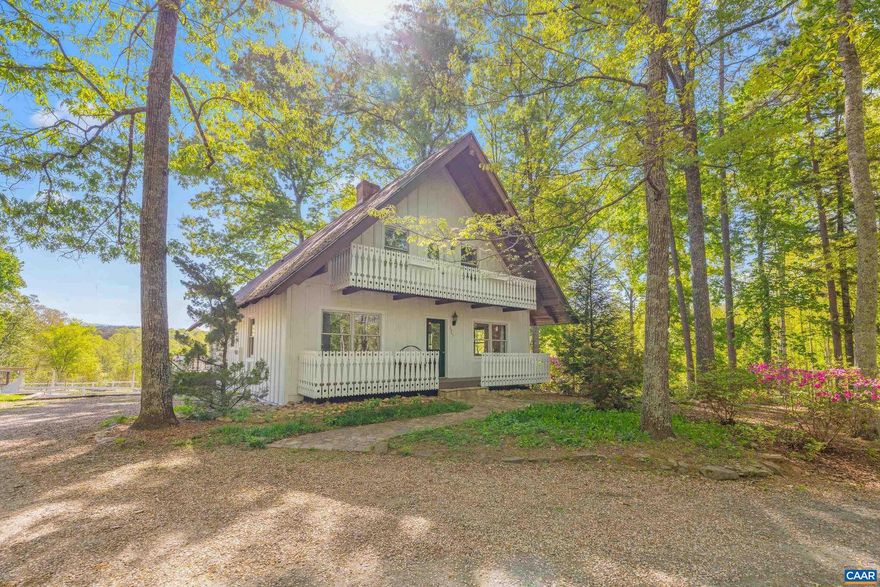 Discover 2947 Merrie Meadows Lane: a turnkey hobby farm where 11 pristine Keswick acres take center stage. Meticulously prepared, the property is secured by high-quality woven-wire fencing, including 8 acres of Sylva pasture and a dedicated garden. A perennial stream forms a serene border, overlooking 132 acres of neighboring land for ultimate privacy and mountain views. The grounds feature a powered open-air barn with a loft, a secondary shed, and a reliable water system with four strategic hard-points and frost-free hose bibs. This parcel meets requirements for potential land-use tax deferral. The refreshed home, built in 1989 to replicate a Swiss Chalet, blends character with modern comfort. The interior offers a main-level primary suite, new stainless appliances, and butcher-block counters. The walk-out basement?with a second kitchen, den, bedroom, full bath, and wood stove?is ideal for a guest suite or farm mudroom. Major 2024 upgrades include a new HVAC system, insulated ducting, and a chimney liner. Perfectly situated approximately 10 miles to Charlottesville, UVA, NGIC/Rivanna Station and the CHO Airport. Experience a manageable, scenic, and fully equipped Virginia homestead.,Maple Cabinets,Wood Counter,Fireplace in Basement,Fireplace in Den,Fireplace in Living Room