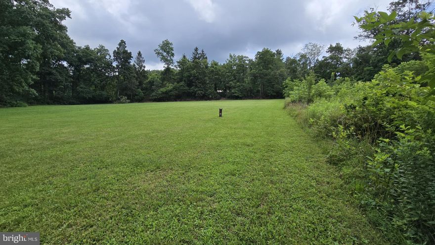 Please do not walk this lot without an agent! Beautiful 1.59 Acre Building Lot w/Utilities & Scenic Surroundings in Northern Frederick County! Build your dream home on this lot nestled in the scenic Catoctin Mountain range. This open, level property features a 40 gpm well and is approved for up to a 6-bedroom home. The driveway apron is already in place, and above-ground electric is available onsite.  Conveniently located just minutes from Rt. 77, this property offers an easy commute to Frederick (30 minutes), Hagerstown, Gettysburg & Waynesboro, PA. It's also a short drive to the revitalized Fort Ritchie, an up-and-coming area that offers a vibrant community center, coffee shop, brewery, and boutique shopping. Another short drive and you'll find Catoctin Mountain Park, Cunningham Falls SP, and the Appalachian Trail. Northern Frederick County is known for its scenic views, farm stands, and year-round recreational activities! Don't miss this opportunity! Book your showing today!