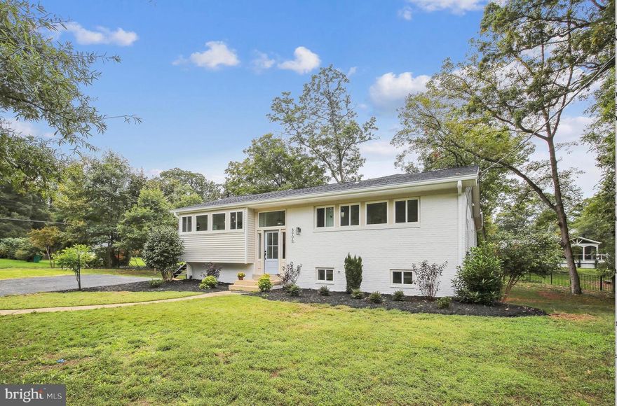 WELCOME TO YOUR NEW HOME! Stunning Newly Renovated Contemporary Home on a Spacious Corner Lot! Nestled in the heart of Alexandria, VA, this  newly renovated home boasts a modern, minimalist design with everything brand new inside and out! Set on a large corner lot, the 3408 sq ft home features a beautifully landscaped front yard with mature trees and driveway. Inside, the home's clean lines and uncluttered aesthetic create a perfect blend of simplicity and functionality. The open floor plan seamlessly connects the kitchen, dining area, and great room, offering an ideal space for entertaining. The entryway is bathed in natural light from large windows. The chef's kitchen is a dream come true with a massive island, ample storage, a drawer microwave, and all-new appliances.  The great room includes a ceiling fan and plenty of space for gatherings. There are windows throughout the first level bringing the outdoors in. The large master suite offers a peaceful retreat with a cathedral ceiling with fan, a walk in closet and large bathroom with double sinks, shower and and a linen closet. Two additional bedrooms are located off the main hallway, along with a full bath. The lower level is fully carpeted and features a bright rec room with large windows that overlook the fenced-in backyard. This space also includes a walk-out door leading to the backyard area, which is perfect for gatherings with a gravel area under the addition. The lower level also offers two additional bedrooms (one suitable as a home office or workout room), a full bath, and a laundry room with plenty of storage space and a utility sink. With thoughtful design, natural light, and modern features, this home is move-in ready. Additionally, this sought-after neighborhood of Sulgrave Manor is close to  a variety of local amenities, including nearby parks, excellent schools, and recreational facilities with an easy commute to the Huntington Metro, Old Town, the Pentagon, and Downtown DC. Don't let this one slip away!