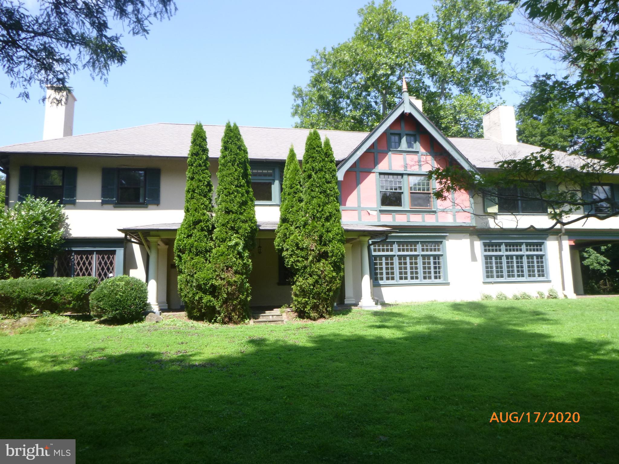 Wow,  Over an acre of land and this historic  6665 square foot home located in desirable Radnor Township.  The home has 8 bedrooms, an office, a family room, 4 1/2 bathrooms and more.   The house includes an inground pool, large patio. and lovely grounds.  Built in 1904, the historic  home was called "Windybrow".  It still has the old world charm, lead glass windows, lots of fireplaces/mantels. and detailed woodwork.  Well below market value for the area,  The home needs an update and is priced so  that there is money left over for upgrades.  Decorate to your own personal taste,  lots of charm to work with here!  You will fall in love...