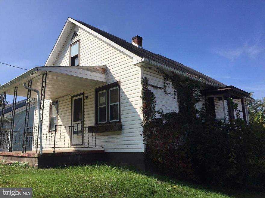 THIS HOME HAS LOTS OF POTENTIAL.  4 BEDROOMS.  OVER HALF ACRE CORNER LOT.  CALL TODAY.