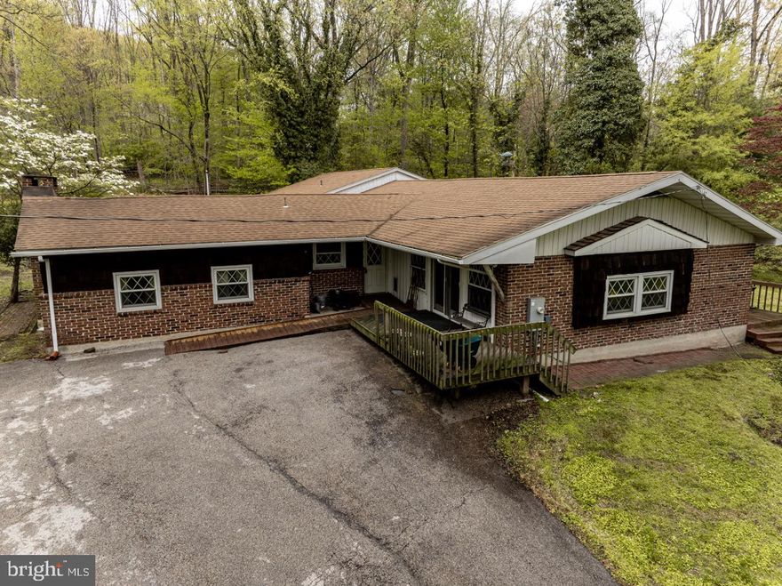LIVE Real Estate Auction will be offered on Tuesday, May 26th at 7:00pm -  Please note: price listed does not reflect the price the property will sell for at auction, it was added for listing and search purposes only.

Tucked away on over 6 acres, this unique mid-century modern cottage offers a rare blend of character, space, and potential. Built in 1969, the 3,028 sqft home features 3 bedrooms and 3 bathrooms, with a partial handicap-accessible layout. Architectural details from the era give the home distinctive charm, while the expansive setting provides endless possibilities for outdoor enjoyment, expansion, or customization. A picturesque stream winds through the property, adding to the serene and natural setting. The property includes three parcels totaling 6.04 acres. Tax IDs: 42-00-00133-414: 0.02 Acres, 42-00-00133-405: 0.28 Acres, 42-00-00133-005: 5.74 Acres


The home needs updating, presenting an excellent opportunity to restore and modernize a one-of-a-kind residence to your exact vision. 

This house is being offered for the estate of Kurt Ulrich who was an avid collector of books and antiques.