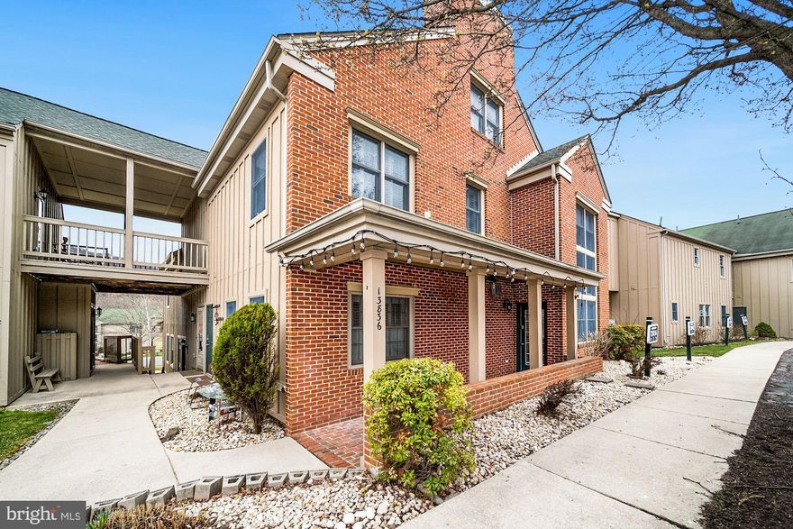 Brace yourself; you have never seen a Whitetail townhome like this before!  As you enter any three entrances, you are surrounded by luxury.  
The renovations in the property are unsurpassed.  The expansive main level is complete with quality stone flooring.  The living room or great room is widely ample with multiple sitting areas.  One area is in front of the stone fireplace, and the other is with an expansive cascading tower of windows.  All the ground-level windows have custom plantation shutters, as well as all the upper-level rooms.  
The kitchen is more than a chef’s delight!  The kitchen renovation included opening it up with everything spanning across one wall with custom cream cabinetry, high-end granite tops, backsplash, high-end appliances, including a refrigerator, wine cooler, dishwasher, and slide-in gas stove!  All lead-out double glass sliding doors to a side deck you won’t see elsewhere in Whitetail.  The photos speak for themselves; experiencing it in person elevates the senses!  There’s a huge pantry and boot and play storage.
There’s a main level bedroom with a fully renovated bath with custom stone flooring, unique vanity, and a full shower.
The second and third levels have designer gray wood-look luxury vinyl tile throughout the hallways, loft, and bedrooms, with tile flooring in each bath.  The two bedrooms are separated by a huge loft overlooking the great room and main level and exceptional views of the mountain and slopes.  The full bath with double sinks has been renovated with the same quality designer accents seen throughout the home.  All the bathrooms have full shower enclosures and, of course, laundry is included on this upper level along with an additional triple-width closet in the hallway.

The owners have designed the top level to be their own suite.  Designed with an open concept, there’s a sleeping area, a sitting area with a free-standing electric fireplace embraced by a custom mantle, a wet bar in its nook with a sink and refrigerator, and a luxury bath.  Double sinks, a separate shower with a beautiful glass stone block enclosure, and a vast spa tub showcase the bathroom.  The level was created to be a spa of its own with exceptional views.

From the front covered front porch to the open side deck to the exterior main entrance and full ski closet, entering the home is a delight.  There are two assigned parking spots out your door and additional guest spots very close by.  Enjoy the pool and hot tub this summer, tennis year-round, walking to the slopes in the Winter, hiking the mountain in any season, and pure luxury living.  The mountain views will take your breath away in the Fall, calm the senses in Spring & Summer and excite the ski and boarders in the Winter.  The home is an actual primary, year-round residence.