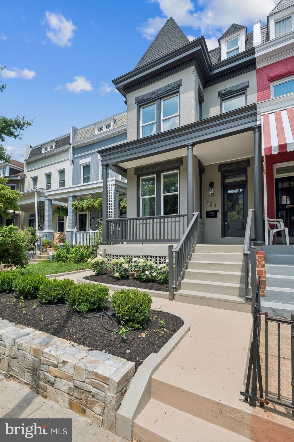 Stunning 4BR/3.5BA semi-detached Victorian rowhome in Columbia Heights, blending historic character with modern luxury across three thoughtfully finished levels. A striking façade and restored original roofline set the tone for the timeless elegance found throughout. This fully renovated residence honors its classic architecture while introducing custom, elevated touches and timeless finishes throughout.
Step into a sun-drenched main level with custom millwork, oak flooring, and layered textures throughout. The striking formal dining room opens into a chef’s kitchen featuring dramatic veined quartz counters and backsplash, a pro-style range, ceiling-height cabinetry, and a built-in wall of custom shelving and glass-front display storage — both elegant and functional.
Upstairs, three bedrooms and two full baths include a serene, marble-clad bathroom with boutique-inspired lighting. The fully finished lower level — with a private rear entrance — offers a fourth bedroom, full bath with matching marble finishes, and flexible living space ideal for guests, office, or income.
Outside, enjoy a deep fenced yard with a rear deck and secure off-street parking for two, privately enclosed by a garage-style roll-up door — a rare and stylish feature that offers both security and convenience in the city.
All just steps from Metro, Rock Creek Park, and the 14th Street corridor — a rare opportunity to own a showpiece home in one of DC’s most vibrant neighborhood