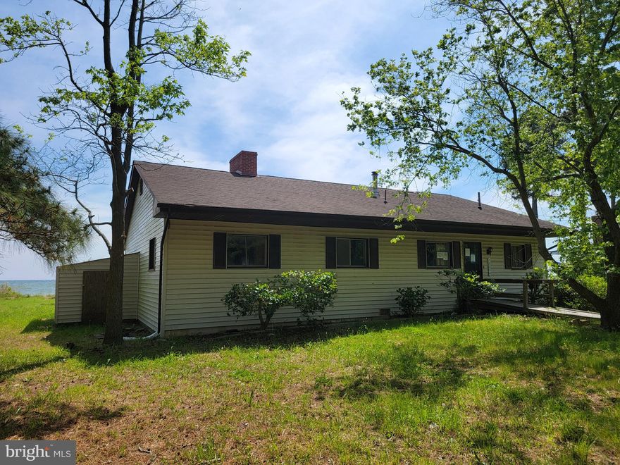 HIGHEST AND BEST OFFERS DUE THURSDAY MAY 9!
This house has SO much potential!  BEACH living right outside your door.  Yes, the house needs work, but it has the square footage to make this a dream vacation or the forever retreat you get to come home to every day.  Currently 3 bedrooms, 1 bath, living room with fireplace, family room and formal dining room.  Driveway for multiple cars and covered back patio overlooking the Chesapeake Bay
PLEASE BE RESPECTFUL OF THE NEIGHBORING PROPERTIES AND DO NOT BLOCK OR PARK IN THEIR DRIVEWAYS OR WALK ON THEIR PIERS.