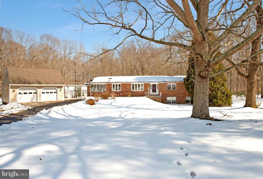 Discover the perfect blend of privacy, space, and convenience on this beautifully wooded 4.43-acre lot located on a cul-de-sac in one of Huntingtown’s most desirable neighborhoods. Tucked away for peaceful country living yet just minutes from top-rated schools, shopping, and dining.  Easy commute to Joint Base Andrews, Pax River, Annapolis, and Washington, DC, this property truly offers the best of both worlds.

Inside, the home features an open-concept layout connecting the kitchen, dining, and family/living areas—ideal for everyday living and entertaining. A remodeled kitchen, new LVP flooring throughout, and a flexible bonus room perfect for a home office or den add modern comfort and versatility. The main-level  primary bedroom provides convenience and ease of living.
The fully finished walk-out basement offers exceptional multi-generational or guest potential with its full kitchen, family room, bedroom, and full bath—perfect as an in-law suite, private apartment, or extended entertaining space.
Car enthusiasts, hobbyists, and business owners will love the incredible outbuildings:
Attached 2-car garage connected by a breezeway
Detached 1-car garage with 3 horse stalls, tack room, and hayloft 
Massive 3,200 sq. ft. garage/workshop accommodating up to 8 vehicles, complete with spray booth and 2-post lift — a mechanic’s dream.
Outdoor living shines with an upper deck, lower patio, fire pit, play area, and a fenced yard with gate for pets, offering endless opportunities to relax, entertain, or enjoy the peaceful surroundings. Plus access to the community’s private pier for fishing and kayaking.
Whether you envision keeping horses, running a hobby business, storing your collection, or simply savoring the quiet of country life, this one-of-a-kind property has the space and flexibility to make it happen.
Schedule your private showing today!