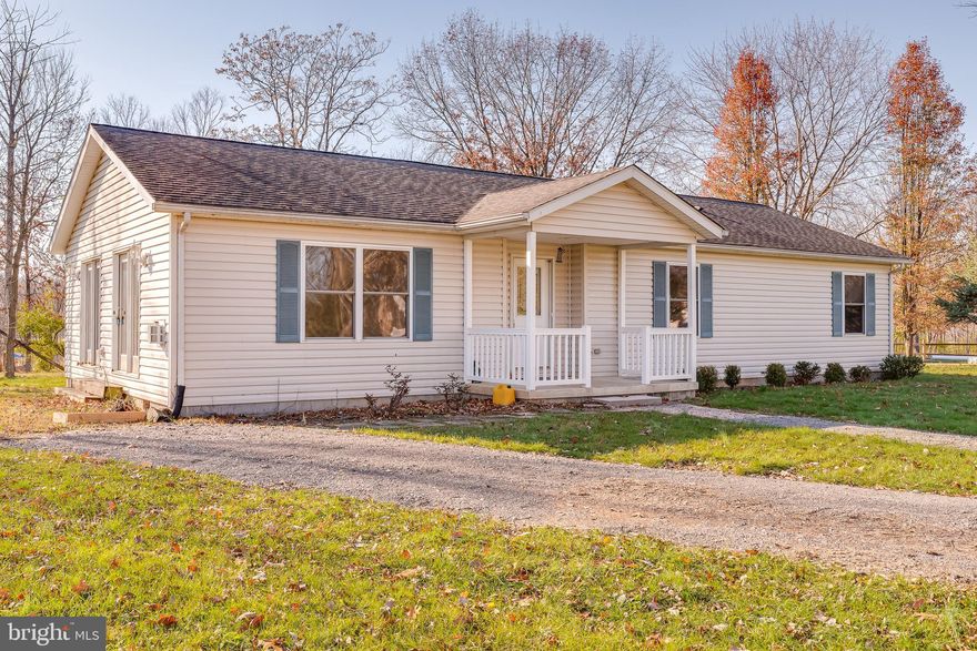 A labor of love.  This great ranch home on 2.04 unrestricted acres has been beautifully updated for the seller by the members of her church. And they did an amazing job.  Brand new appliances, polished wood floors throughout home (no carpet in house), all freshly painted - including kitchen cabinets (they look brand new).   And it's a great one-level floorplan.  Open flow from Living-dining to island kitchen  and the large windows and glass doors let in lots of light.   There's a large dirt floor structure outside with a 2 car garage door. Can be used as a garage or workshop (it has electricity) or storage.  Bonus - No HOA to deal with -- getting more rare to find in this area.  So - an updated, one level ranch home with open floorplan, wood floors, new kitchen, gas fireplace  on 2+ acres.  Checks all the boxes folks.  See for yourself - call for a preview.