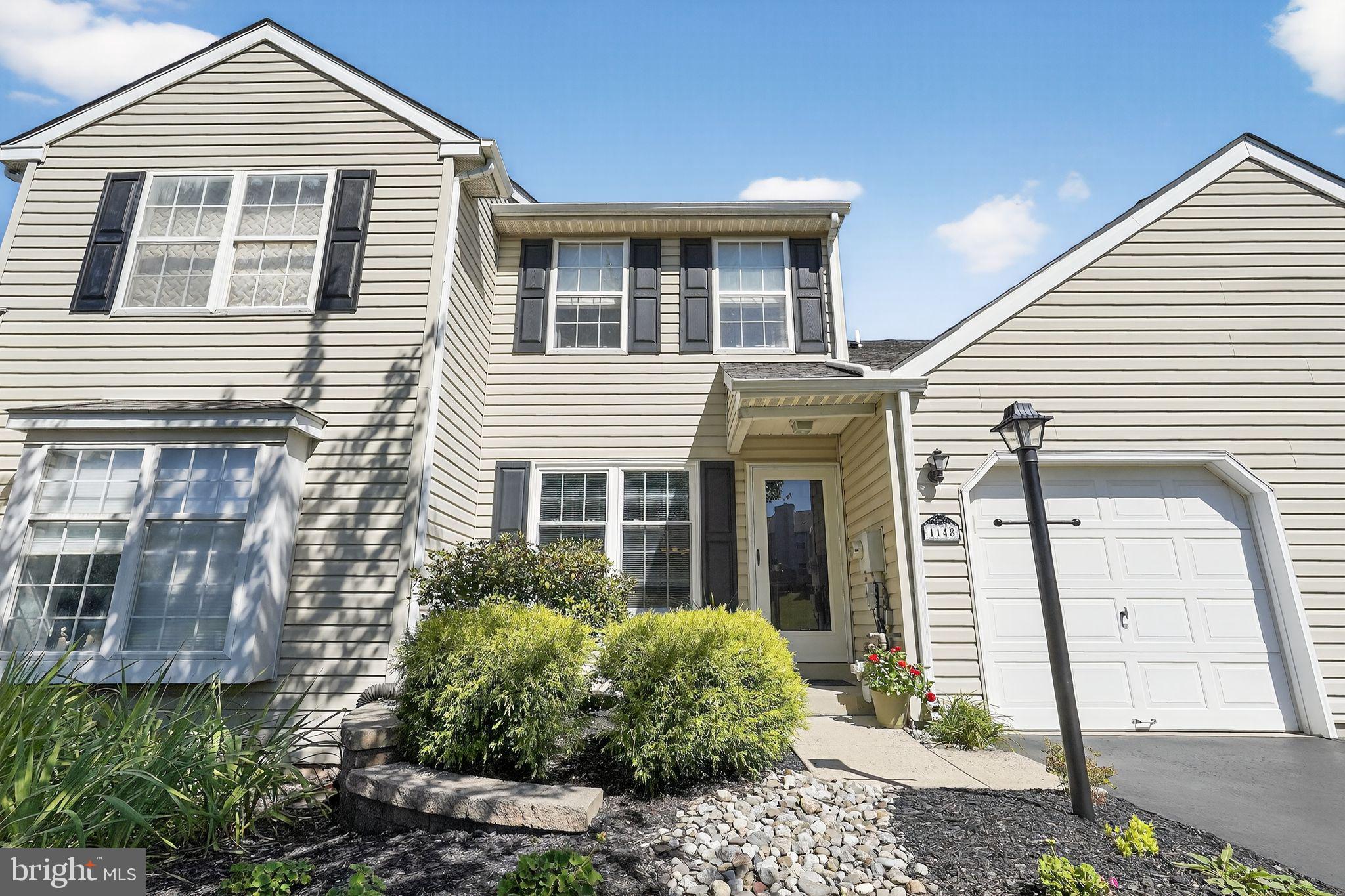 Welcome to this inviting 3-bedroom, 2.5-bath townhome in the desirable Stonegate community. Situated on a premium lot backing to treed open space, this home offers a peaceful setting with plenty of privacy. The main level features a bright family room with a wood-burning fireplace, recessed lighting, a ceiling fan, and an atrium door leading to the deck — the perfect spot to enjoy the wooded views. The eat-in kitchen includes granite countertops, ceramic tile backsplash, a built-in microwave, and cabinetry with a convenient lazy Susan. Upstairs, the primary bedroom offers a ceiling fan with light, attic access in closet, and a private bath with a tub/shower. Two additional bedrooms with carpet, a full hall bath with a tub and oversized linen closet, plus the convenience of second-floor laundry complete the upper level. Additional highlights include an attached 1-car garage, newer roof, HVAC system (approx. 7 years old), a walk-out unfinished basement offering excellent storage or future living space, and easy access to overflow parking conveniently located nearby. With its combination of comfort, functionality, and tranquil backdrop, this property is ready for its next owner to make it their own.