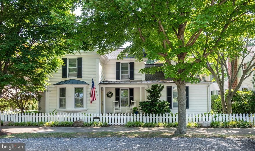 Discover the charm of 213 S Morris Street, an exquisite residence nestled in Oxford, MD's historic district. Originally built in 1870 by a skilled shipwright, this home was meticulously restored with a "down to the studs" renovation, seamlessly blending historic charm with modern luxury. The property boasts a gated brick and river stone driveway, providing off-street parking.  The property is fully enclosed by both a historic brick wall and an Oxford-style picket fence ensuring privacy.  The grounds are professionally landscaped and irrigated for natural beauty and feature a large blue slate patio for outdoor living. The home features a separate heated and air-conditioned studio/office, perfect for creative pursuits or remote work. Inside, the beautifully decorated interior offers a primary bedroom (with en-suite bath) on the first floor and three additional bedrooms upstairs. With three bathrooms—including two on the second floor, one on the first, plus a powder room—comfort and convenience are paramount. Enjoy cozy evenings by one of the four gas fireplaces or entertain in the stunning family room with vaulted ceilings and clerestory windows that adjoins a gourmet kitchen equipped with a six-burner Wolf stove and top-of-the-line appliances. The home is bathed in natural light, with top-quality windows and doors, and features pristine pine floors throughout. It's a "happy house," radiating warmth and elegance, and its reproduction costs in today's market would far exceed the list price.