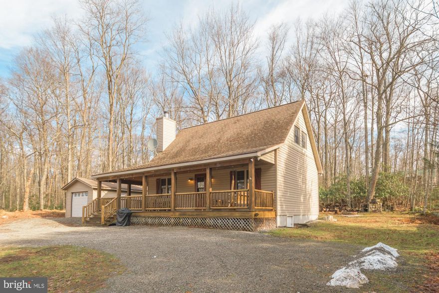 3-bedroom, 1-bathroom property located in the heart of Yough Mountain Resort. It is situated less than a quarter mile from the community clubhouse, pavilion, and tot lot, making it an ideal location for families and outdoor enthusiasts. This well-kept cabin offers a blend of comfort and adventure, perfect for a relaxing getaway.Charming cabin w/all the right stuff. Wood burning fireplace w/stone surround, wood floors throughout, vaulted wood planked ceilings, beautiful kitchen w/wood cabinets, the right mix of wood & drywall walls, a wrap around covered porch & wired for sound inside & out. Yough Mtn Resort offers days of 4-wheeler trails, club house & play ground. Great vacation get-a-way or full time residence.