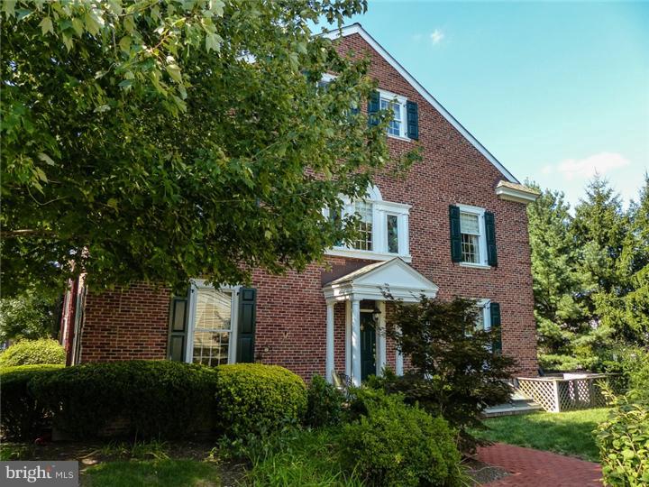 Stately, brick end unit townhome w/ 4 levels of elegant living. HW flrs t/o as well as oversized windows, allowing for lots of natural light. The brick fp w/custom built-in bookcases on either side is the focal point of the spacious LR. The formal DR has lovely moldings & a sliding glass door to a beautiful, private flagstone terrace which is surrounded by trees & lush landscaping. The kit, w/extensive cabinetry, also has a breakfast area, Subzero refrig, cooktop range & tile flring. The luxurious MBR suite includes a marble fp & vaulted ceiling w/interesting architectural lines which encase high-set windows allowing sunlight to flood the room. The MBR extends to a large dressing area w/2 double closets, sitting room & master bath. The 3rd flr Princess suite has interesting architectural roof lines, new engineered HW flring, a walk-in closet & full bath. The inviting LL is nicely fin, has new carpet & a wetbar w/mini refrig. A 1-car detached garage & central vac system complete this amazing home.