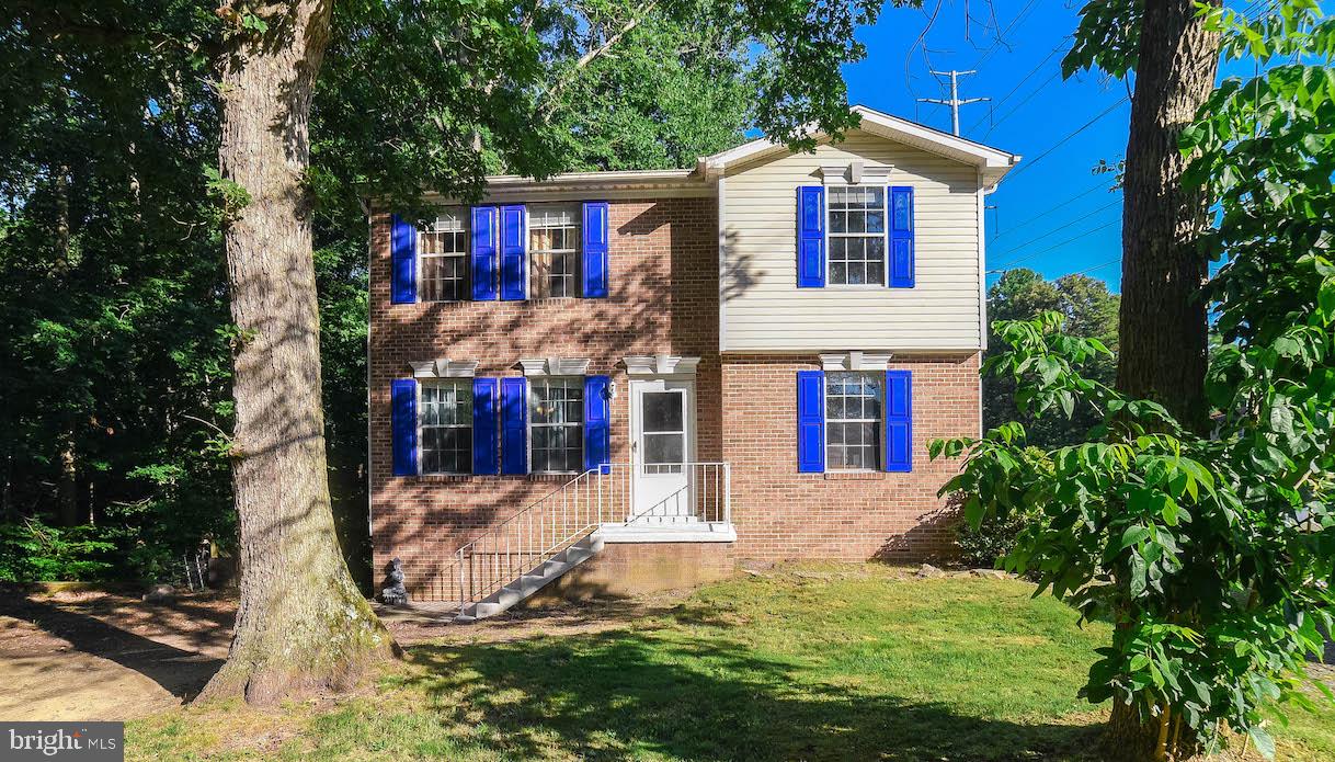 White Sands Colonial with room to stretch out! This 4 bedroom. 3.5 bath beauty features a huge Bonus Room addition w/bar for entertaining and a finished basement with bedroom and full bath. Good looking laminate wood flooring throughout main level. You'll love the big eat-in kitchen with white cabinets and stainless appliances. Kitchen is open to living room and french doors lead to bonus room. Lower level also has space for media, fitness or game room, its own entrance and fridge and cabinets are already in place for a potential kitchenette. Would make a great in-law suite! Main floor has nook that's perfect for a computer desk or hobby table. Upstairs bedrooms all feature ceiling fans and primary bedroom has attached bath. Lots of fresh paint throughout! Yard backs to trees and has room to play. Plenty of parking between driveway and extra parking pad. Conveniently located near Solomons and Prince Frederick and an easy commute to PAX, too! This affordable home is ready for you. Come see it today!