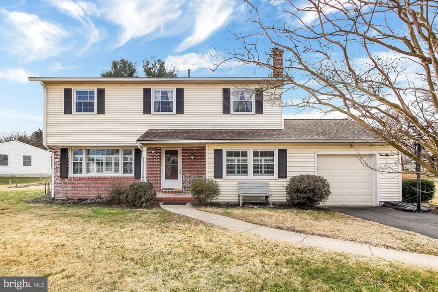 Beautifully Updated 4 Bedroom in desirable location! This home has it all! Open Concept Kitchen, Living and Dining Rooms, with lovely hardwood floors, stainless steel appliances and a modern feel. Den/Family Room on main floor features a wood burning fireplace, and a sliding barn-style door. Main Floor Laundry Room and half bath with incredible tile floor.  Upper Floor hosts spacious dual entry bath with tile surround in shower and farm-style sink, 4 large Bedrooms with hardwood floors, and luxurious Master Bath with dual vanities and concrete counter top and shower with dual shower heads! Flat backyard with large concrete patio (20x16). Make your appointment today to view this spectacular property! ONE YEAR AHS HOME WARRANTY PAID BY SELLER