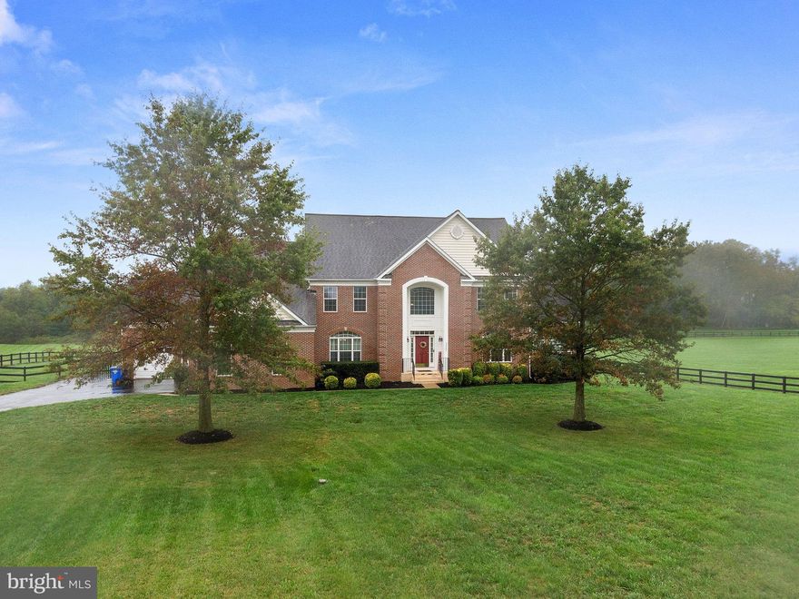 Welcome to 42245 Fording Branch Court - peace and tranquility await! This stunning estate home features over 7,800 sq feet and is an entertainer’s dream!  Both formal and casual spaces come together to create a thoughtfully designed home. The main level features a formal living and dining room, sunny corner office, light-drenched conservatory with double-sided fireplace, and a casual eating area just off the kitchen. The gourmet kitchen is well appointed for hosting gatherings of any size! Just off the kitchen is the sunken family room centered around a cozy stone fireplace. Finishing out the main level is a powder room, main level laundry, and a spacious rear mud room leading to the garages. On the upper level, you will not be disappointed with the generous bedroom sizes! The primary bedroom suite boasts a tray ceiling, separate private sitting room, walk-in closet, and luxurious bathroom appointed with large soaking tub and shower. Bedrooms two and three have a shared bathroom while the fourth bedroom has access to its own private bathroom. On the lower level, prepare to be amazed! The open recreation room has endless possibilities for gaming and entertaining, including a full bar area, theatre room, home gym, second office and storage space!
Outside, you can spread out on your screened porch or enjoy the open air on your spacious deck, all overlooking your fenced, manicured yard. Situated just minutes away from downtown Leesburg, breweries, wineries, major commuter routes and shopping, you don’t want to miss this stunning estate home!