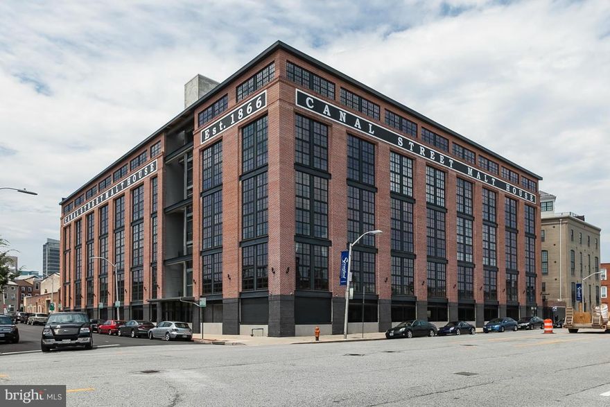 Live large in this extraordinary architecturally redesigned industrial loft boasting over 2,900 sq.ft.The floor plan maximizes an incredible sense of openness & style.Features:dramatic Great Room w/loft overlook,sleek kitchen w/ SS appliances & Cambria counters,2 en-suite BRs/BAs,hickory wood fls,2 pks spaces.The home is enhanced w/ an unique blend of exposed duct work,columns,steel,brick & wood.