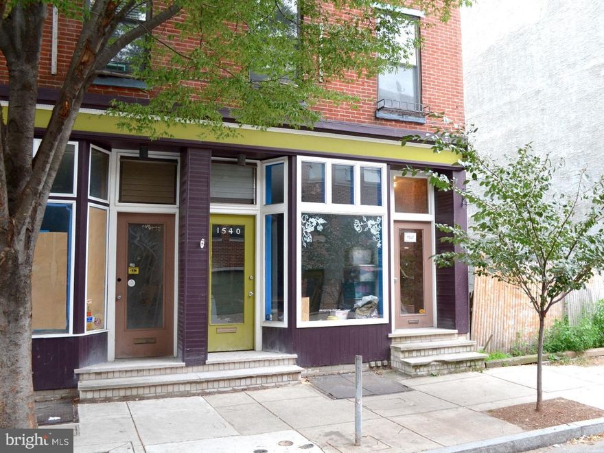 ATTENTION INVESTORS!  Excellent fully rented Triplex in outstanding location - adjacent to the new development slated for the historic Royal Theatre on South Street.  Consists of a First floor retail space, Second floor 1BR, and Third floor bi-level 2BR.  The retail space has separate entrance, storefront bay window for prominent street level display.  High ceilings, bathroom, separate office area, access to breezeway and small yard.  Includes full basement for storage, mechanicals, and w/ bilco door street access.  Upper floor apartments have separate entrance w/ exposed brick wall and carpeted stairs.  2nd floor 1 BR enters into the open living/dining room w/ oak hardwood floors and connects to the all white galley kitchen w/ linoleum floor.  Bright hallway leads to bath w/ tub/shower and laundry.  Bedroom has large closet w/ lofted storage and access to a private walled deck. 3rd floor bi-level has hardwood oak stairs, enters to open living room w/ wood burning fireplace, l-shaped all white kitchen/dining room w/ linoleum floor has south-facing sliding glass doors to large deck.  Skylit stairs to upper level, 2 large bedrooms w/ closet storage, 3 piece hall bath w/ tub/shower.  Pull down stair for mechanical roof access.  The building was totally renovated in the late 1980's by the architect/owner and is well planned with excellent natural light and good storage.  Units rent easily and are in well maintained condition.  Central location in the commercial heart of the Graduate neighborhood, just off the Avenue of the Arts (south Broad), steps to Rittenhouse Square. And with 98 walkscore, 94 bikescore, and 80 transitscore easy to get anywhere in the city.  Take a look at this fantastic investment opportunity today!