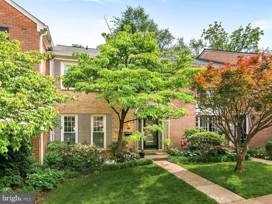 MULTIPLE OFFERS! Welcome home to this updated, all brick townhome featuring 3 spacious bedrooms, 2 full baths and 2 half baths, in a quiet enclave with private sidewalks and no through traffic! *Haycock Elementary, Longfellow Middle, and McLean High School pyramid* This home backs to mature trees and a peaceful common area, offering privacy and tranquility.  The bright eat-in kitchen boasts Silestone countertops, pull-out shelves, and updated cabinet hardware. Hardwood floors run throughout the main and upper levels, with ceramic tile on the lower level. The elegant dining room overlooks the impressive two-story living room, which features a cozy wood-burning fireplace with brick surround. The fully finished lower level offers a spacious recreation room complete with a wet bar, built-in bookshelves, an electric fireplace (conveys), a half bath, and a beautifully remodeled laundry room with granite countertops, a utility sink, and ample storage. The private fenced flagstone patio provides the perfect outdoor space for entertaining or relaxing. *Patio furniture and fire-pit convey!* The elegant primary suite includes a renovated bathroom with a walk-in shower, designer tile, and upgraded vanity. Plus, there are two spacious secondary bedrooms with hardwood floors and large closets. Recent updates include full interior paint and designer lighting in 2025, patio and fence improvements in 2023, a steel front door and shutters in 2021, attic fan and insulation in 2020, and a new heat pump in 2016. The roof and oversized gutters were replaced in 2015, along with the remodeled primary bath, washer and dryer, microwave, and hot water heater.
Located in the sought-after Haycock Elementary, Longfellow Middle, and McLean High School pyramid, this home is just 1.5 miles from the West Falls Church Metro station and minutes to I-66, I-495, and Dulles Toll Road. Air travel? You can choose between Reagan National and Dulles Airports. Enjoy easy access to downtown McLean, Tysons Corner, and the City of Falls Church, with nearby shopping, farmers market, and dining options. Assigned parking included. This hidden gem combines comfort, style, and convenience in an unbeatable location. Must see!