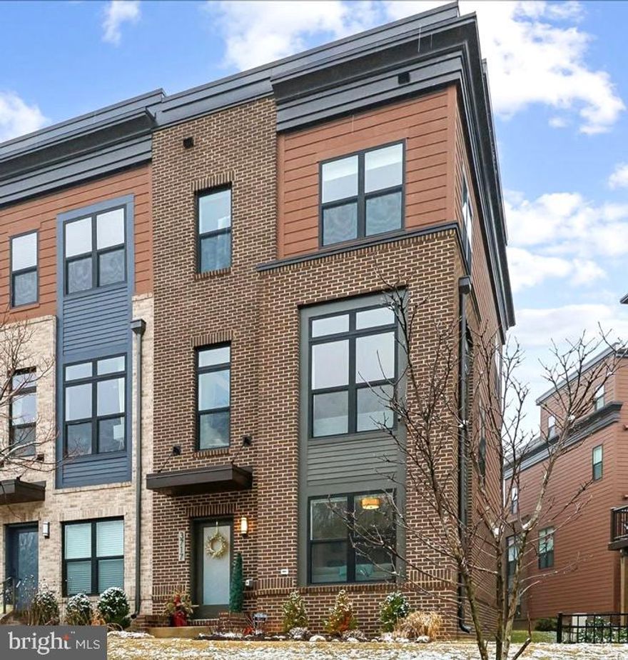 Sought-after and rarely available, this premier corner end-unit in the Reserve at Tower Oaks offers what few can: unobstructed preserve views, exceptional privacy, and sun-filled southwestern exposures.
Completed in 2021, this four-level EYA townhome is ideally positioned to capture glowing afternoon light and open, leafy vistas throughout.
The entry level features a private office with frosted-glass French doors and oversized corner windows, plus access to the two-car garage with built-in storage.
The main level is bright, open, and designed for living and entertaining. The kitchen, dining, and living areas flow seamlessly around a gas fireplace with custom built-ins, complemented by designer lighting, oversized windows, and a walk-out composite deck with pocket screen. A convenient powder room for guests completes this level.
Upstairs, the primary suite offers custom walk-in closets and a spa-like bath with dual vanities and glass-enclosed shower. This level also includes a second bedroom with ensuite bath and a walk-in closet, as well as full-size laundry.
The top floor is dedicated to a spacious family room, third bedroom, and full bath, plus a rooftop terrace with TV and retractable awning—perfect for extending living space across seasons.
Additional features include a full-house activated carbon water filtration system and exterior security cameras.
The Reserve at Tower Oaks community amenities include a pool, fitness center, event space, coffee bar, and package storage. The HOA fee is $249/month and covers trash, snow removal, and lawn care.
This rare residence is superbly situated close to Pike & Rose, Park Potomac, Montgomery Mall, and convenient to I-270, I-495, and the ICC, creating ease of living in an ideal location.