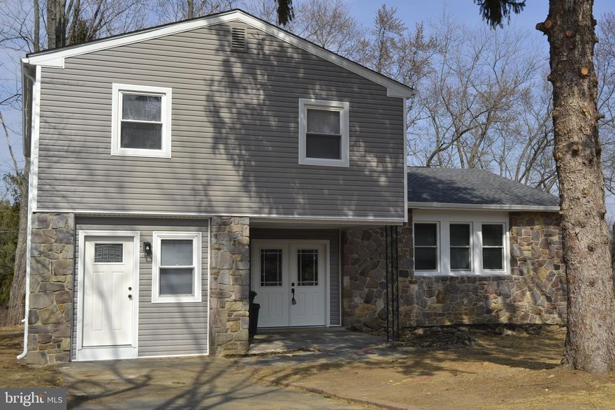Enter into this freshly updated 4 BR, 3.5 Bath home with a bonus room on the first floor which has an outside entrance. This room also has an attached full bathroom. Can be used for in-laws, the oldest teenager or a home office. The main entrance leads into the foyer. From there, step-up to the open concept formal living room into the dining room. Attached you'll find an updated open kitchen with stainless steel appliances and designer quartz counter tops. The kitchen steps down to a custom family room with mounted TV over the fireplace. This room has a door which leads you out to large fenced rear yard. Upstairs you'll find 4 newly carpeted bedrooms. The main BR offers a beautifully upgraded ensuite with double sinks and oversized walk-in shower. The tiled hall bathroom also provides a large double sink. The lower level provides some additional living space and a large storage area. New roof and siding has warranty attached.