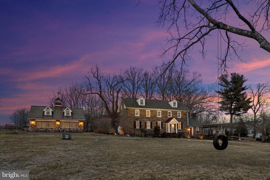 This magnificent equestrian estate, Fieldstone Farm, built in 1747, is an incredible CORNER LOT that stands on over 100 stunning acres in the heart of historic Bucks County. Steeped in rich history, Bucks County was first inhabited by the Lenape Indians and later settled by European colonists, including Swedes, Dutch, and Quakers. The area played a crucial role during the Revolutionary War, with George Washington launching his famed crossing of the Delaware from its banks. This estate, including a beautifully restored stone farmhouse and guesthouse, seamlessly blends 18th-century charm with modern luxury. The main house boasts 5 bedrooms, a custom gourmet kitchen, and 3.5 baths, offering a retreat for the most discerning buyer, gentleman farmer, or equestrian.  The main residence, enhanced by skilled renovations and modern touches, preserves the unique architectural details of the era. The 1782 date stone on the property's cottage bears the initials A (Adam), C (Charity), and B (Barr), hinting at the involvement of Charity Barr during Adam’s military service in the Revolutionary War. The estate once flourished as a bustling agricultural hub, complete with cider works, stills, orchards, and barns. This exceptional home features three stunning fireplaces, each adding warmth and character to its beautifully curated spaces. The original walk-in fireplace, now transformed into a charming sitting area, provides the perfect setting to unwind with craft cocktails in a space steeped in history. The dining room showcases a magnificent fireplace with its original mantel, creating a refined and inviting atmosphere for elegant gatherings. In the graciously sized living room, another fireplace is complemented by original built-ins, blending function with timeless style. Just off the kitchen, the laundry/mudroom is a standout feature, boasting custom-built storage that enhances both convenience and sophistication. 
The 1782 carriage house/guesthouse,  includes a designer kitchen, dining room, great room with a stone fireplace, 2 bedrooms and full bath.  
Outbuildings, such as a stable, outdoor riding ring, and a climate-controlled garage, cater to equestrians and car enthusiasts alike.  Additionally, a 2.5-acre buildable lot provides space to expand and create your vision. This exceptional property marries history with modern elegance, reflecting both the heritage and beauty of Bucks County.   
The farm is also part of Bucks County history: Set amidst the picturesque pastoral landscapes of Buckingham Township, Pennsylvania, Fieldstone Farm spans 103 acres of equestrian beauty and historic charm. Dating back to 1747, this 18th-century stone estate encapsulates the region’s deep-rooted history, tracing its origins to the Morrey family, whose legacy includes Humphrey Morrey, Philadelphia’s first mayor appointed by William Penn. Through the centuries, this estate has witnessed transformations under multiple owners, from the Barr family—who expanded its agricultural prominence and historic structures—to notable subsequent caretakers such as the Rittenhouse and Foster families.

By the 20th century, Fieldstone Farm saw a variety of changes, from ownership by European immigrants to its eventual showcase as the 2010 Bucks County Designer House and Gardens, showcasing the dedicated work of designers who revived its interiors and exteriors. Today, Fieldstone Farm remains a testament to Bucks County's rural past, enriched by layers of history and a panoramic view that reflects the timeless beauty of its surroundings.