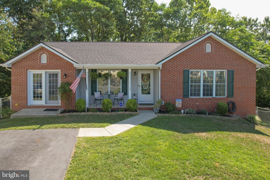 WOW! Take a second look at all this 4+BR/ 3BA home in Wildflower Ridge has to offer.   Over 2,500 total square feet with 5 distinct and well-lit versatile rooms with bedroom, office, playroom opportunities you can bring your whole family and work from home!  The owner's suite is picture perfect with a well-organized walk in closet space, full bathroom with well-lit vanity and shower all on the main level!  Two additional traditional bedrooms and a large living space for home office, theater room or studio are also included on level one.   The well-kept eat-in kitchen has up to date appliances, decorative backsplash, table space and a large pantry. Open to the main living room and back deck, the kitchen is a central focus of the home creating a great flow for entertaining, family dinners and grilling on the deck while catching Sunday afternoon football.  The living room is cozy and has sunshine filled mornings through the large front window.  The main level also includes additional hallway and entry closets, luxury vinyl plank flooring, ceiling fans and a second full hallway bathroom. 
A fully finished basement is not to be overlooked especially when the space has been well planned to suit many needs.   A full living room, bathroom and bedroom are situated in a full walk out basement as well as several large storage closets and a dedicated dry storage room with carpet and shelving.  This is a gorgeous space for extended family, friends or  your own quiet space.  The  spacious laundry room is also in the basement level with clean, open space and unique amenities like a pull down folding table. 
It is rare to find a home at this price level in this condition in Berkeley County.  This home has EVERYTHING!  Schedule your showing today!