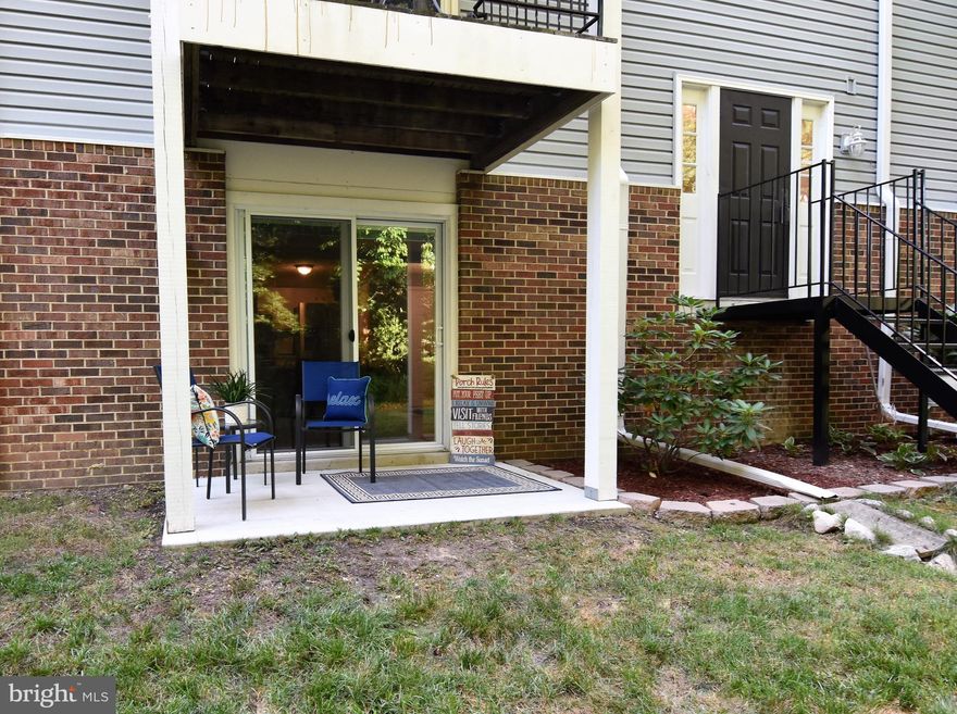 Walk out level condo....beautifully updated and ready for you to call it home!
Relax on your back porch, walk right out the sliding door and enjoy the privacy and quietness the tree lined view provides.
Home was just painted neutral gray complimenting the beautiful wood look flooring.
Primary bedroom dressing area isn't your typical vanity, separate sink with plenty of storage.  Walk in closet with custom organizer.  
Newer slider windows and sliding door.
Don't worry if you need a little closing help, seller remembers and will help!