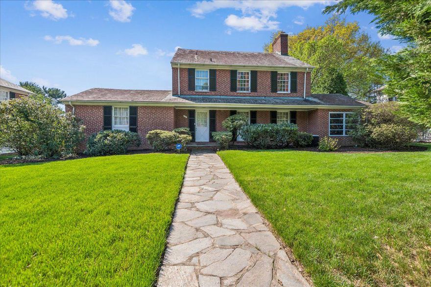 Classic brick colonial in Homeland with four bedrooms, one of which is on the first floor. Two levels of living with the opportunity to have either first floor suite or maintain the space as a family room. Highly sought-after layout within a bucolic setting. Enjoy a quick stroll to the lakes or a relaxing evening in. Preparing a meal is a breeze with the walk-in pantry and new appliances, replaced in 2024-2025. The eat-in kitchen could accommodate a lovely breakfast nook. A banquet-sized dining room, a sizable sun porch, and a flagstone patio give a plethora of options for dining. After a meal, entertain in the living room while enjoying the wood-burning fireplace. With twenty paned windows, eight over twelve, there is an abundance of light throughout the day. A two-car garage supplies plenty of space for outdoor gardening tools, with plenty of extra storage just steps away in the lower-level entry. A large lower level can also be finished to increase square footage and offer a third level of living space. Extensive mature trees and a myriad of outdoor entertaining spaces assure the owner a restorative space, while still being minutes from 83 and 695.