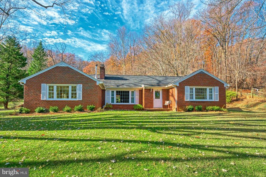 Absolutely Immaculate all Brick home is as cute as it can be!  Located this side of Warrenton on route 17 allows access to many major roads.  As you drive down a very long driveway leading to the home, you will be amazed at the  private setting!  Once inside the home, you will feel the warmth and serenity this home provided.  Minutes to Old Town Warrenton, route 29 and Gainesville, this charming  Rambler sits on almost 2 acres of mature shade trees and cleared land for any homeowner to enjoy!  Upon entry, you will be amazed at the oversized Family Room and vaulted ceilings and all the Hardwood flooring on the main level.  The unique feature and center of this home is the wood stove.  This "Sweetheart" cooking  stove  by Heartland is from Canada.   These retail for about $5K.  It not only warms the home it also allows the homeowners to cook, bake and draw hot water.  Sellers have meticulously maintained the home and improvements which include bathroom remodel 2023 all new windows 2022 and HVAC system 2021.  You will love the oversized picture  overlooking the front yard as well as the other new windows, which help to keep the home warm in winter and cool in summer.  Eat in Kitchen with new glass Refrigerator is located conveniently off the rear door. Lots of Cabinets with updated hardware for storage.  Three Bedrooms, each with closets and overhead lighting and each with hardwood flooring.  Spacious Primary Bedroom partially remodeled  Bathroom with new vanity,  walk-in shower and Shiplap Walls.  Dining Room with adjoining Living Room with wood burning Fireplace and mantel.  Finished lower level with ceramic tile floors and walk up stairs to rear yard. Laundry room plus large storage room.  Huge detached Garage has heat, AC and electricity with plenty of room for storage, a workshop or add two cars.   1.62+ acre lot, with lots of space to build on or add a pool. NEW HVAC SYSTEM, NEW WINDOWS, REMODELED PRIMARY BATHROOM!