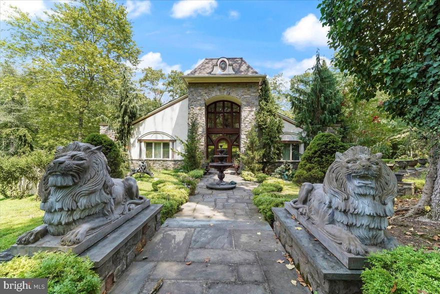 Welcome to this majestic French Contemporary Retro Estate home on a fabulous  level 2.76 acre lot overlooking the Springton Reservoir.  The views are spectacular from the 2000+ sq. ft Veranda which surrounds this home---perfect for entertaining both outside &  inside. The grand main entrance opens to a
large entrance hall with gleaming hardwood floors, high ceilings  and exquisite mahogany doors.  A large great room area boasts. a 2-sided  fireplace, a grand Dining Room (currently used as a music room); a spacious Kitchen with reservoir views opens to Dining Area with 2-sided fireplace and door to the Veranda with Hot Tub. The main level also offers a Powder Room, Sun Room and Laundry Room.  Enjoy the first floor Primary Bedroom- Suite-very Romantic with doors opening to the Veranda, a  2-sided Fireplace (to be enjoyed in the Bedroom Suite or the custom Bathroom), 2 oversized walk-in closets and a Primary Bath with a large walk-in Shower, Jacuzzi Tub, his & her sinks & beautiful Mosaic Floor.. There are 2 additional Bedrooms and large Hall Bath as well.  Take the Staircase to the large Loft which adds entertaining space galore in your own custom Billiard Suite!
The lower level boasts almost 2000 sq. feet of finished space which includes a Bedroom, a full Bath, a Sitting Room and a Great Room that is walkout to the beautiful grounds,  There is approximately 2000 sq. ft of  additional currently unfinished space with a massive Cedar Closet.
Walk out to the gorgeous grounds ! There is a 3.5 car oversized garage and beautiful fountains and much much more.  This is truly one of the nicest properties in the area--a must see!!  Close to Ridley Creek State Park, local hospitals, shopping  & restaurants,  Located in the Rose Tree Media School District !