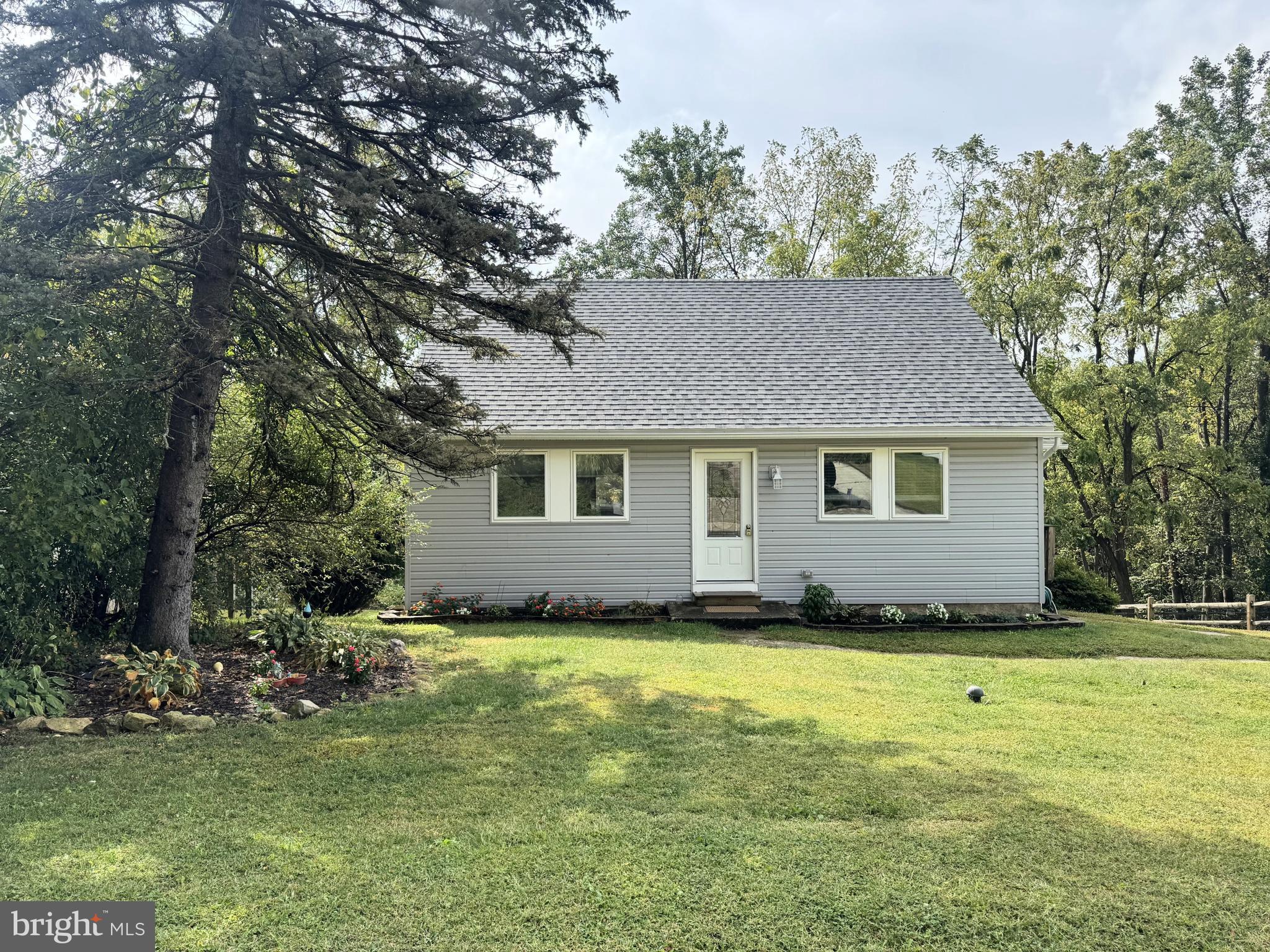 This Boyertown Cape has been recently rebuilt with tons to offer! Bright and open first floor offers spacious living room, modern kitchen with door to side and rear deck, as well as a full bathroom and two nicely sized bedrooms. Upstairs, the roof was remodeled to add additional height and living space. There is another full bathroom on the second floor. The unfinished basement is great for additional storage and features rough-in bathroom plumbing. Driveway parking and a nice sized yard that opens to wooded area. All appliances, HVAC, water heater, etc are less than 2 years old, offering peace of mind. Cats allowed, dogs are case by case basis with breed restrictions. Tenants cover all utilities. Available October 1st.