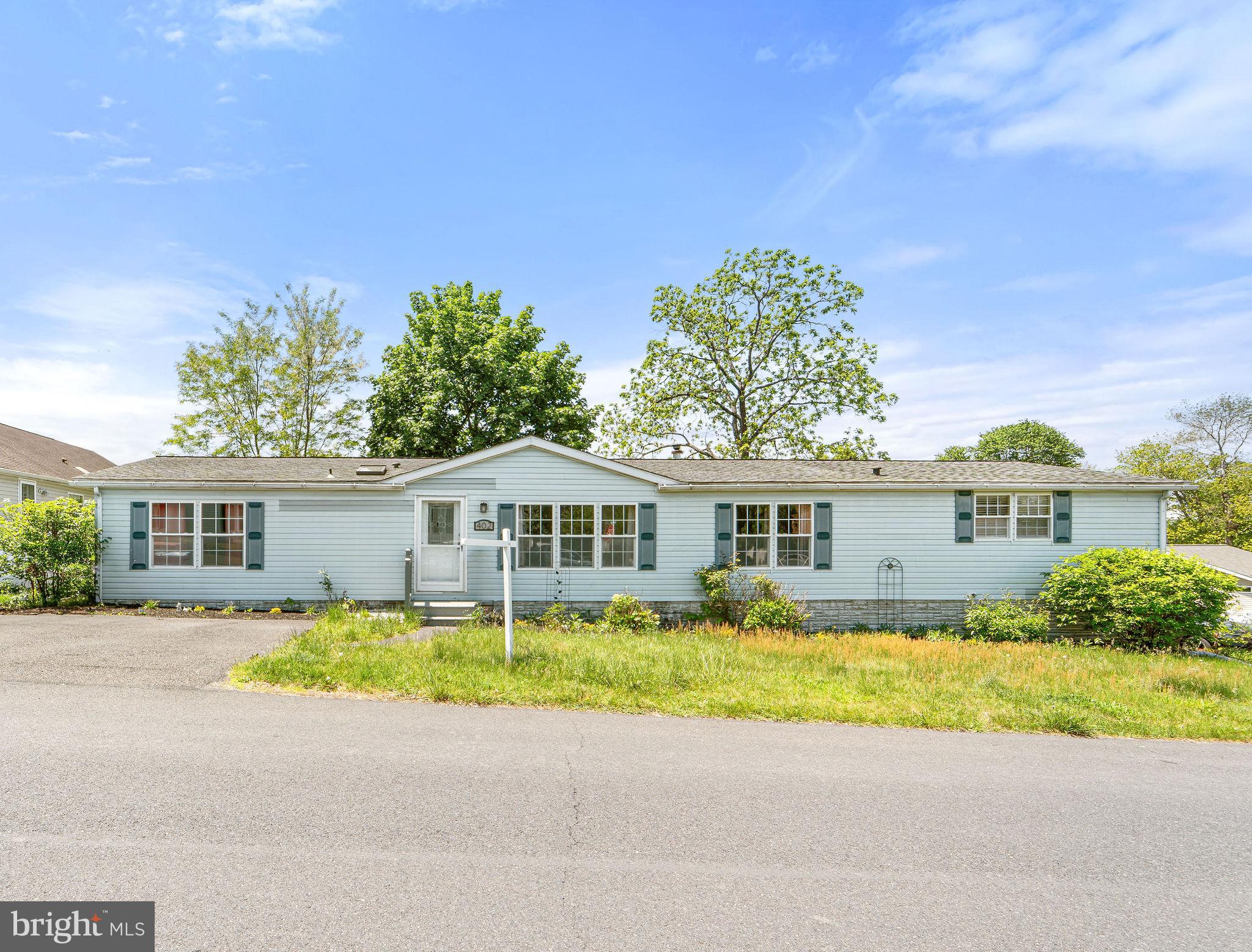Come see this large 3 bed 2.5 bath home on a corner lot just minutes away from the center of all that Doylestown offers, walk and bike trail, shopping and restaurants. Walk through the front door and you will be greeted with a large living room/dining room area with vaulted ceilings. Large windows in the front of the home and skylights bring plenty of natural light. The kitchen has plenty of cabinet space, island seating and a pantry. Off to the side of the kitchen is a family room with built-in cabinets and desk. Master bedroom is a nice size with a large closet, master bath with double sinks, soaking tub and shower stall. Laundry room has a utility sink and half bath. Two more bedrooms and a hall bath complete this great home. Outside is a shed and parking for two vehicles. Home is being freshly painted with more pics to come!