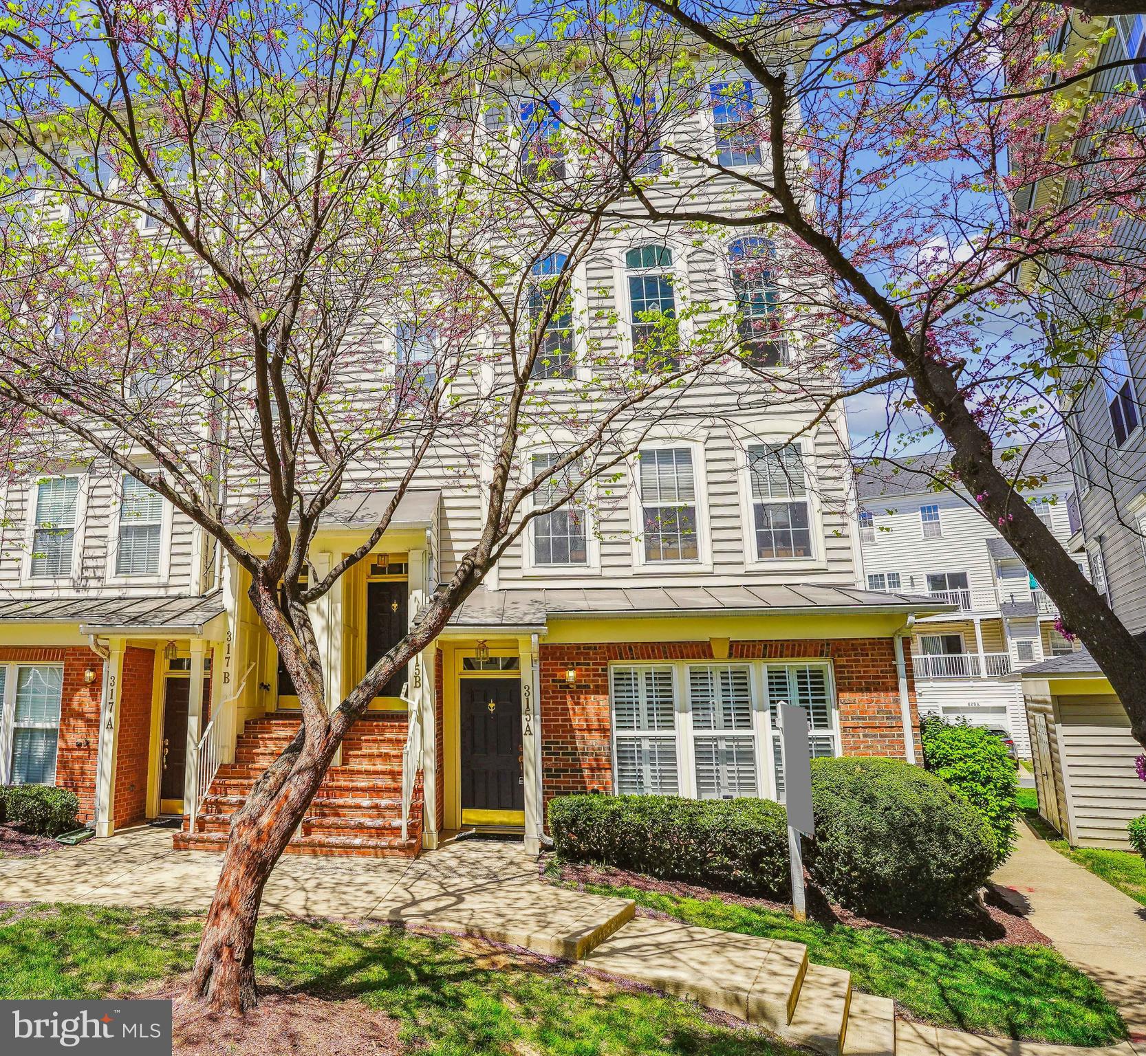 Bright and sunny end-unit townhome-style condo overlooking picturesque Cross Green! The spacious living room is filled with natural light and features luxury vinyl flooring, crown molding, and a gas fireplace. The living room flows seamlessly into the dining area, complete with a custom chandelier, and adjoins the updated kitchen, which boasts stainless steel appliances, granite countertops, a breakfast bar, and elegant white cabinetry with decorator hardware. A pantry closet and a charming powder room round out this level. Upstairs, the light-filled primary suite showcases decorator lighting, two closets, a ceiling fan, and an updated en-suite bathroom with a double vanity. The second bedroom is bright and roomy, featuring a double-door closet with an organizer system. The second full bathroom offers decorator lighting and a tile floor. The airy, light-filled loft provides flexible living space and opens directly onto a spacious private deck, perfect for relaxing or entertaining. The attached garage provides convenience and extra space for storage. Facing the picturesque Cross Green courtyard, this home is ideally located close to the countless shopping, dining, and entertainment options this award-winning community has to offer.