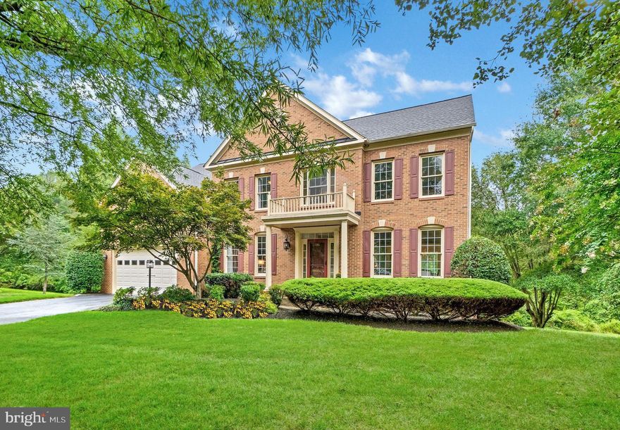 Fall in love with this extraordinary expanded MI McLean model, peacefully positioned on a tranquil cul-de-sac. Overlooking a tapestry of mature trees, this residence boasts a gracious 2-story foyer, featuring ceilings ranging from 9 to 10 feet in height. Hardwood floors compliment the main level, guiding you through an expansive kitchen replete with a central island and upgraded appliances. The family room showcases a wood-burning fireplace embraced by a full stone surround.

Step onto a secluded screened-in porch, offering treetop panoramas, and take in the tranquility. Dual custom decks further enhance the outdoor experience. The primary suite is a sunlit haven complete with a sitting room that beckons relaxation. This suite also indulges with two closets and a spa-inspired luxury bathroom. An additional three bedrooms and two full bathrooms provide comfort and convenience.

The spacious fully finished walk-out lower level is an entertainer's dream, featuring a discreet fifth bedroom, a full bathroom, and a generous recreation room. For those seeking practicality, two separate storage rooms cater to organizational needs. This lovely home is nestled within the esteemed Willows of Potomac community, offering access to a communal pool, tennis courts, a clubhouse, basketball court, and scenic walking paths.

Roof Replaced in 2018 with transferrable warranty.