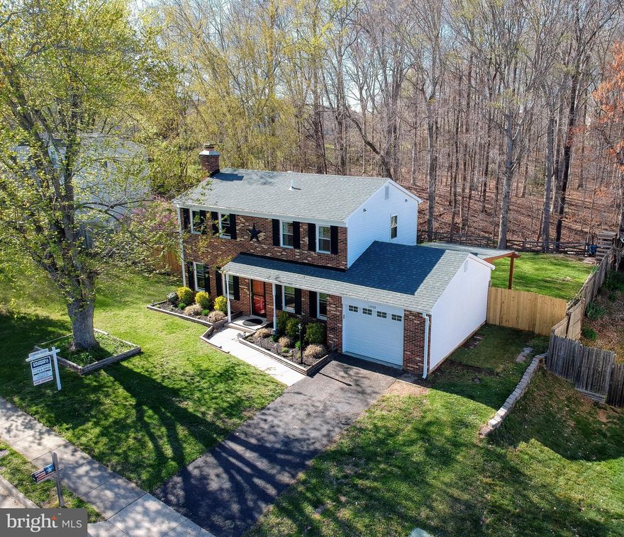 Multiple Offers*Gorgeous UPDATED Brickfront Home w GARAGE on HUGE Level Fenced Lot Backs to TREES! Outstanding VALUE at a Townhome Price*Beautiful DREAM Kitchen wCustom Maple Cabinets* Built-In Pantry*Breakfast Bar*Dining Room for Entertaining! Spacious Living Rm w Brick Fireplace*French Door to Private YARD*Master wDressing Area*Full Bath*Walk In Closet*Bedrooms 2 & 3 UP w Hall Bath*Covered Porch