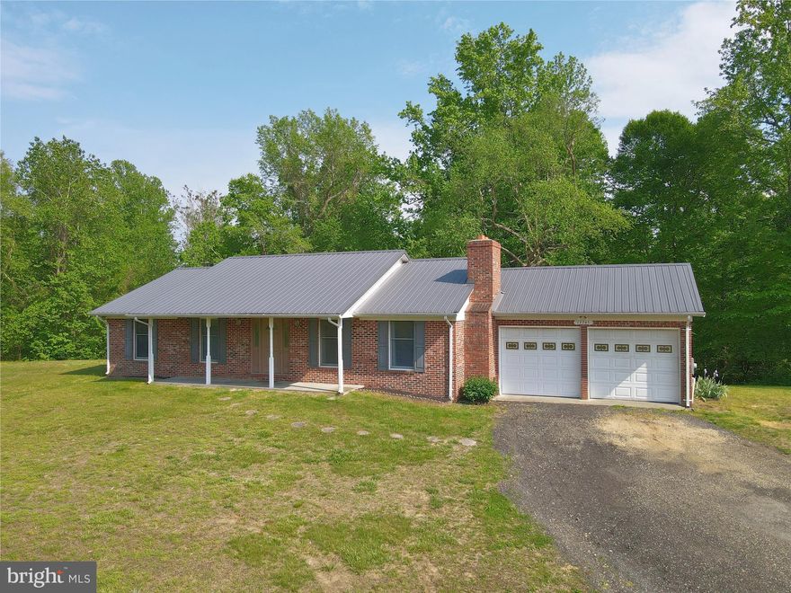 Don’t miss this rare opportunity to own 7.35 acres in Prince George’s County’s sought-after Rural Tier. Zoned AG (formerly OS), this property is ideal for a farmette, equestrian use, or private estate living. No HOA or covenants. The all-brick rambler features a durable steel roof, attached 2-car garage, and a custom brick fireplace ready for a wood stove. Interior highlights include a spacious country kitchen, cozy family/living room, and a large 24’x16’ rear deck perfect for outdoor entertaining. The huge partially finished basement has a full bathroom, a storage room, laundry room, a hobby room that can be used as a possible 4th bedroom and a large recreational room with unlimited potential.  There is a chimney flue access to also add a wood stove / pellet stove to the basement as well! The shed and run-in are sold as-is. Set on a private, open and wooded lot accessed via a shared gravel road, the property is currently farm-assessed for lower taxes.  Located along the Legacy Wine Trail, and just minutes from Merkle Wildlife Sanctuary, Jug Bay, and the Patuxent River Park system. FIOS Internet is available at the end of the driveway. Reasonable commute to Washington, D.C. metro area. A minimum of 5 acres per dwelling unit applies under AG zoning. The seller will not pay for the Agricultural Transfer Tax into residential use. All showings must be scheduled in advance. Buyer's representative must be present at all showings.