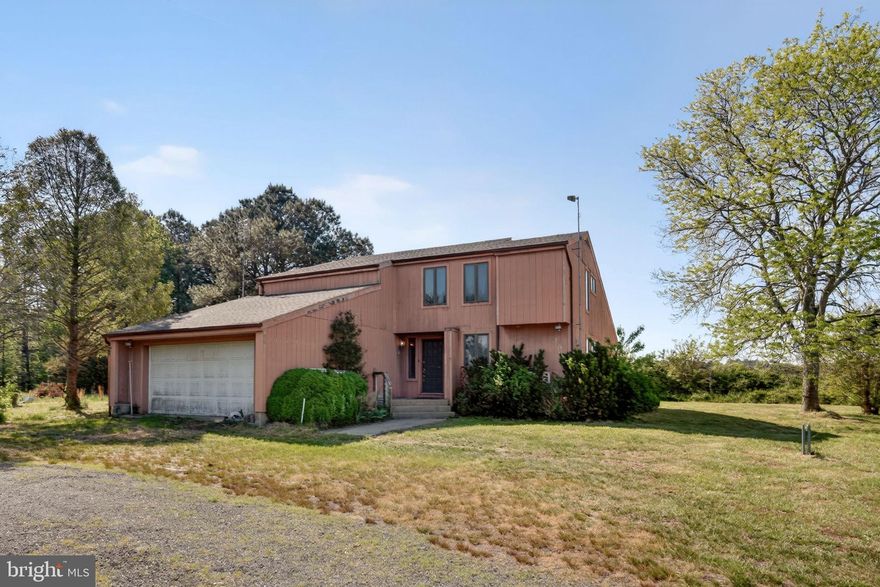 Discover this unique 12.5-acre property just minutes from Pocomoke City and less than 2 miles from Cedar Hall Wharf on the scenic Pocomoke River. Designed by renowned architect Charles Koty, this contemporary passive solar home offers energy efficiency and an open floor plan with 4 bedrooms and 3.5 baths and a new roof. Interior features include three custom stone heat-absorbing walls, a bright 12x12 sunroom, seven sliding glass doors, and five clerestory windows that fill the home with natural light. Step outside to a spacious composite deck overlooking the peaceful surroundings, including your own 80x100 man-made pond. The property consists of approximately 11.5 acres zoned agricultural and 1 acre zoned residential, offering flexibility and privacy. Additional highlights include a finished garage, wheelchair-accessible ramp with lighting, SimpliSafe security system, and high-speed fiber internet through Talkie Communications. Properties offering this much land, privacy, and unique design are rare?schedule your private showing today.
