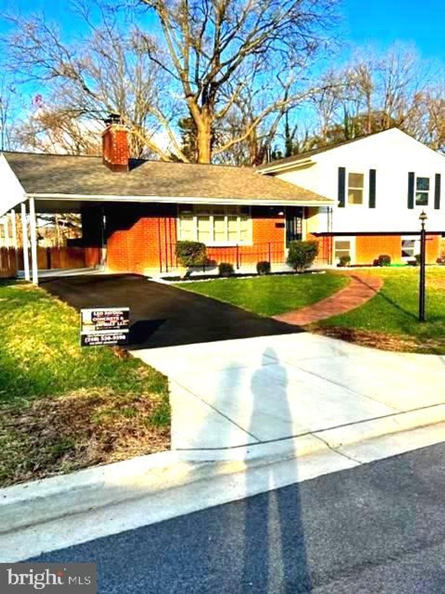 Don't miss this opportunity.  Buyer unable to perform. Move In ready. 3 levels*3 sides brick/siding house. Four bedrooms; 3 full newly decorated baths updated with new tubs, toilets, vanities, ceramic tile walls and floors; and new fixtures.  Sparkling refinished hardwood floors main and upper levels; and newly installed luxury vinyl floors basement level. Updated  kitchen with new garbage disposal; dishwasher; faucets; and all recent appliances. Open living room with huge bay window, electric fireplace. bar, and gourmet kitchen.  There is a  side entrance to carport and back entrance to deck .  Basement sports a large recreational room  for entertaining and a fourth bedroom and full bath; separate laundry room/utility room.  Basement level has lots of windows for natural light.   Open floor plan.   Fully fenced back yard and entrance to basement level.
 New HVAC; shingled roof; hot water heater; washer and dryer;   Newly painted and .  Driveway newly black-topped and sealed.  Just bring your imagination.