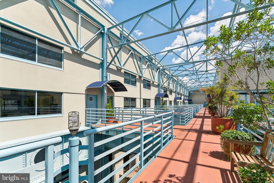 Spacious tri-level residence with an excellent floorplan boasting marina and river views at Pier 5
Condominiums. The entrance to this sun-filled home is located off of Pier 5’s gorgeous, shared garden space. Enter the home through a foyer with large coat closet that leads to the first floor living space and stairs up to the second floor. Past the spacious kitchen and open formal dining room is a sunken living room with fireplace and wall of windows overlooking the marina and Benjamin Franklin bridge. There is ample space for both living and entertaining. The fully equipped kitchen features ample white cabinetry, garden views, tile floor, and a pass through overlooking the dining room. There is a powder room off of the dining room. Up the stairs on the second floor is the primary bedroom with oversized windows, two wall closets, a fireplace, and a beautifully appointed ensuite bathroom. The primary bathroom has a double vanity, jacuzzi tub with frosted window above that can be opened to the bedroom, and a separate room with toilet and stall shower. The generously sized second bedroom has a large wall closet and enjoys use of a full hall bathroom with single vanity and tub shower. There is a hallway laundry closet with a side by side washer and dryer. The third floor has another spacious bedroom with wall closet and walk-in closet that could also be used as an office/den. It enjoys an ensuite full bathroom with single vanity and glass stall shower and access to the massive roof deck with unobstructed bridge and river views. There are new vinyl floors throughout. Residents of Pier 5 enjoy a 24-hour doorman, lush outdoor gardens, an oversized river deck, access to the Delaware River Trail, and on-site management. The residence includes one parking space in the building’s parking garage.