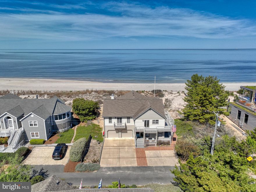BIG BAY VIEWS! Take a front-row seat for panoramic sunrises & sunsets and catch the sea breezes over the picturesque dunes leading to the Delaware Bay. This spacious home has had only one owner, has never been a rental and has been perfectly maintained. With tons of bright open space and large kitchen your family and guests will never want to leave. The spacious owner’s suite is on the living level with all guest rooms on the lower level. Two huge wraparound porches add even more square footage to spread out! Plus a 2 car attached garage for all your vehicles and beach toys. Stroll to the Lewes Yacht Club from peaceful section of Lewes Beach that's just far enough from all the action and still close enough to walk or ride a bike to Downtown Lewes restaurants and shops. It’s time to make  your beach dreams a reality!