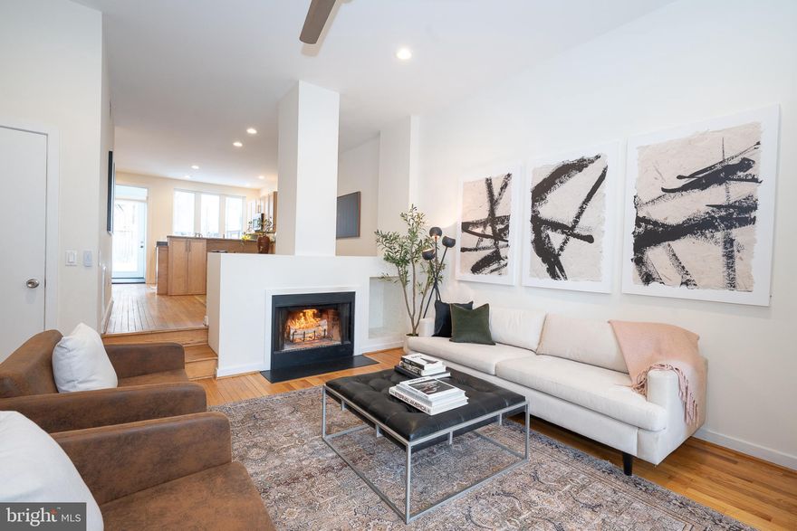 Welcome to 2949 Pennsylvania Avenue, where Philadelphia charm meets an effortlessly cool lifestyle in the heart of Fairmount Park.  Picture morning coffee runs on a tree-lined street with sidewalks, evening dog walks in the park after work, sunset views off your deck, weekends at the Philadelphia Art Museum and meeting friends at favorite local restaurants.  This 4-bedroom, 2.5 bath townhome offers over 2,200 square feet of sun-drenched space, a finished lower level and the ultimate city luxury - private parking!  As you enter the main level you are welcomed by the open layout with high ceilings and a wood-burning fireplace.  The kitchen is bright, sleek and made for entertaining, featuring polished quartz countertops, stainless steel appliances, generous cabinetry and beautiful windows that pour in light. A glass door leads to a mudroom perfect for four-legged friends - then out to your private patio and grassy yard with irrigated gardens, a hidden oasis for gatherings with friends and family.  Just beyond the fully fenced yard there you'll find your dedicated off street private parking spot and a bike shed. The second floor offers a serene primary bedroom, full bath and additional bedroom currently styled as an office.  The third floor has two more bedrooms and a large bathroom with double sinks.  The 3rd floor deck is ideal for watching the sunset over Lemon Hill, viewing the Philadelphia skyline and perfect for watching the 4th of July fireworks. Finally, the finished lower level adds even more flexibility for a work out space or media room along with laundry and storage.  All this, just minutes from Boathouse Row, Kelly Drive, the Schuylkill River Trail and quick access to I-76.