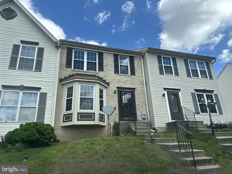 This Colonial style townhouse combines solid construction with convenient neighborhood access. Brick exteriors provide classic curb appeal and durability, while the finished basement expands living potential beyond the main floors.

The home features multiple bathrooms throughout. A large basement great room with fireplace creates flexible space for recreation, relaxation, or additional living needs. The lower level transforms into a functional extension of the home with its completed design. Brand new rear slider to deck installed.

Location highlights make daily errands and recreation accessible. The property sits near Bear Creek Park, offering outdoor recreation Nearby. Proximity to Dundalk Elementary School serves residents with school-age household members. Shopping convenience is within reach—Logan Village Shopping Center is nearby, and Merritt Park Shopping Center is just minutes away. Heritage Park provides additional green space in the immediate area.

This townhouse delivers practical value in an established Dundalk neighborhood with parks, schools, and retail all within easy reach.
